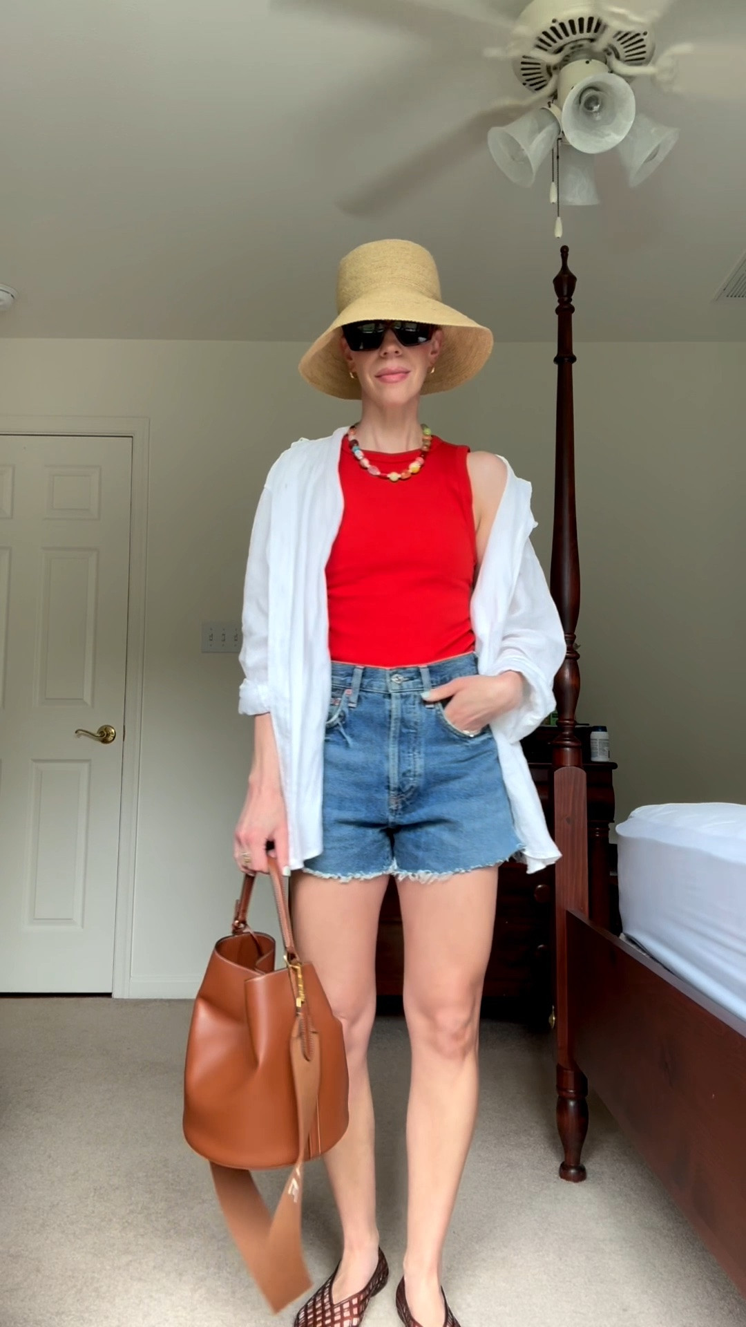 Casual summer outfit with @Janessa Leone straw bucket hat, red tank top, cutoff denim shorts, jelly shoes, beaded necklace

#LTKSeasonal #LTKgrwm #LTKOver40