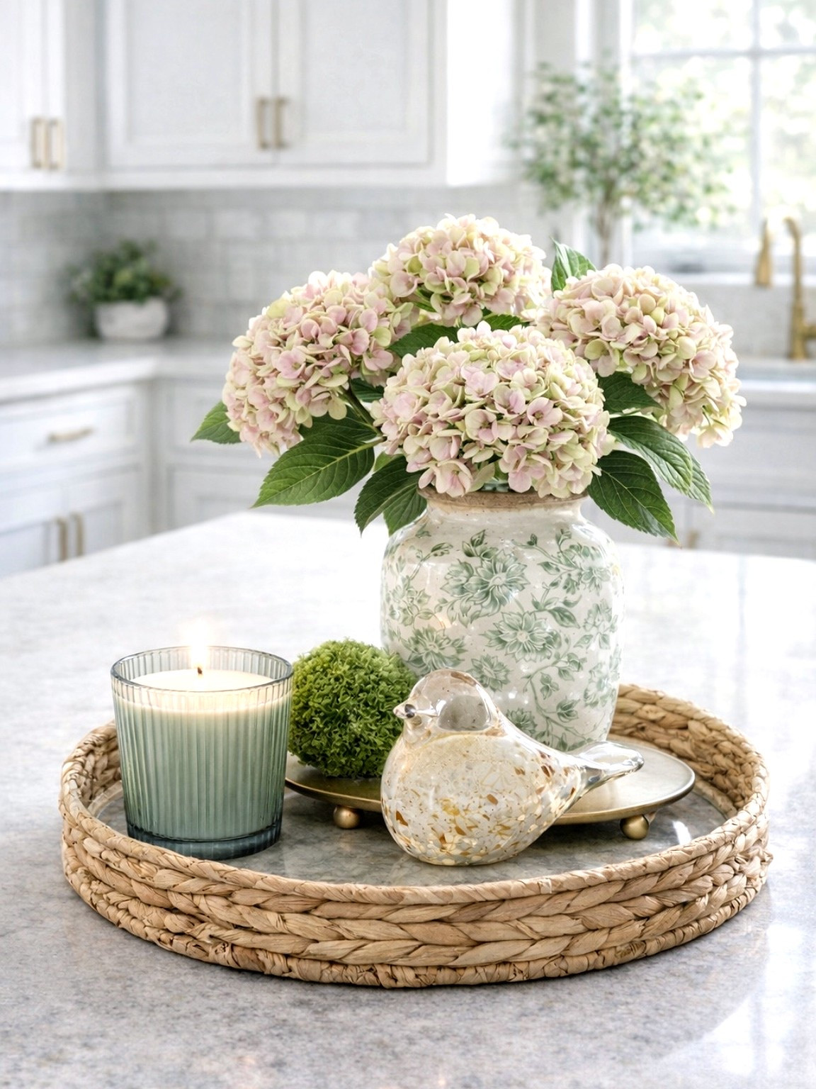 This is how we make a kitchen feel ready for spring🤍

We start with one soft floral moment, layer in texture with a woven tray, then add a pretty candle for warmth. This hydrangea + green glass candle combination instantly softens hard surfaces and makes the island feel styled, not staged. Everything linked. 



#LTKOver40 #LTKHome #LTKSaleAlert