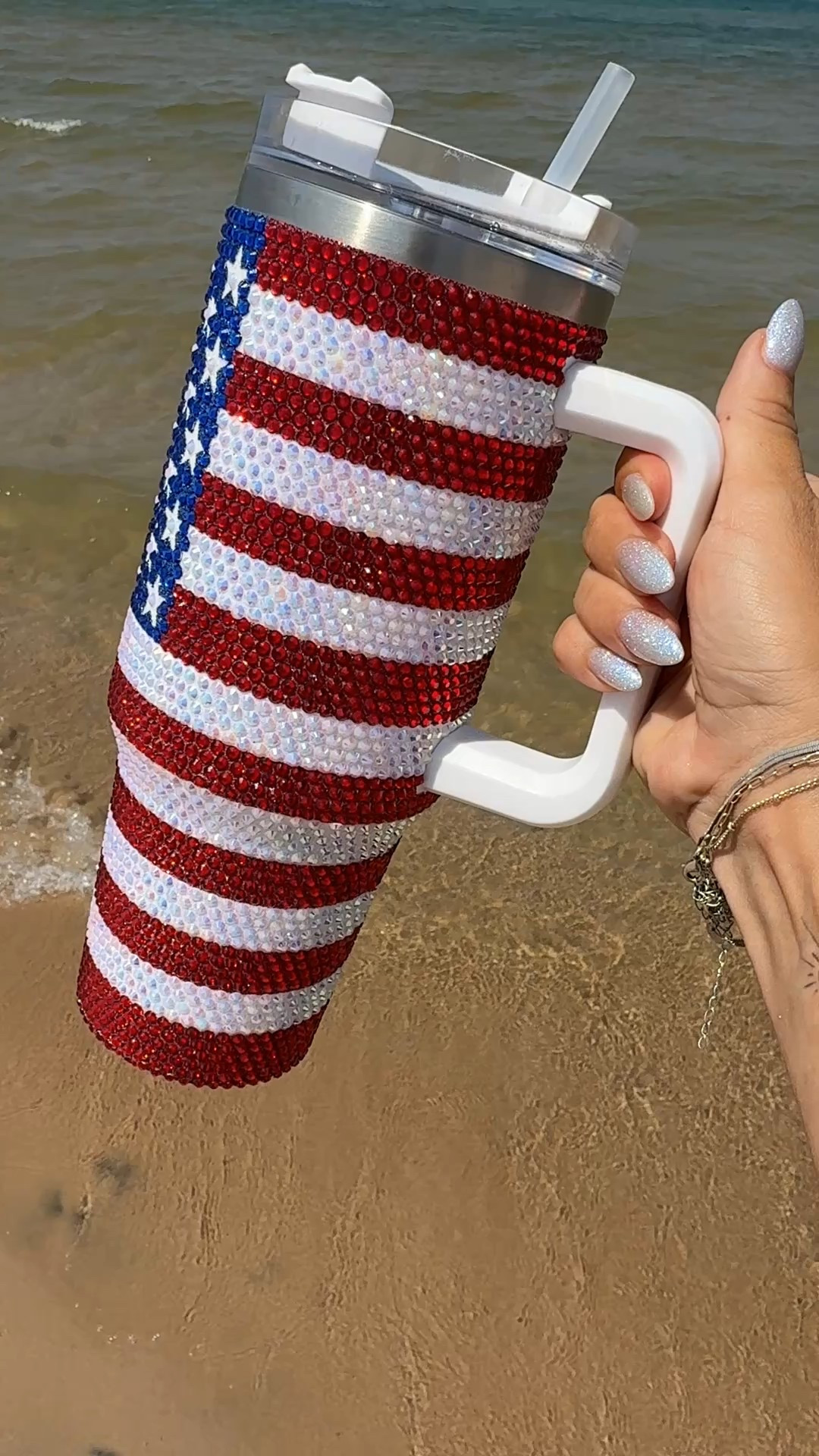 Sippin’ in sparkle 🇺🇸✨ This rhinestone American flag tumbler is my new beach day essential—keeps drinks ice cold and adds all the festive flair. Comes with a handle, straw, and lid so it’s perfect for lake days, BBQs, or any patriotic moment.

🔗 Linked on LTK!
#LTKsummer #AmazonFinds #PatrioticVibes #BeachDayMustHave #TumblerCup #SparkleTumbler #USAStyle #RedWhiteAndCute #LTKhome #DrinkwareFavorites

#LTKSeasonal #LTKActive