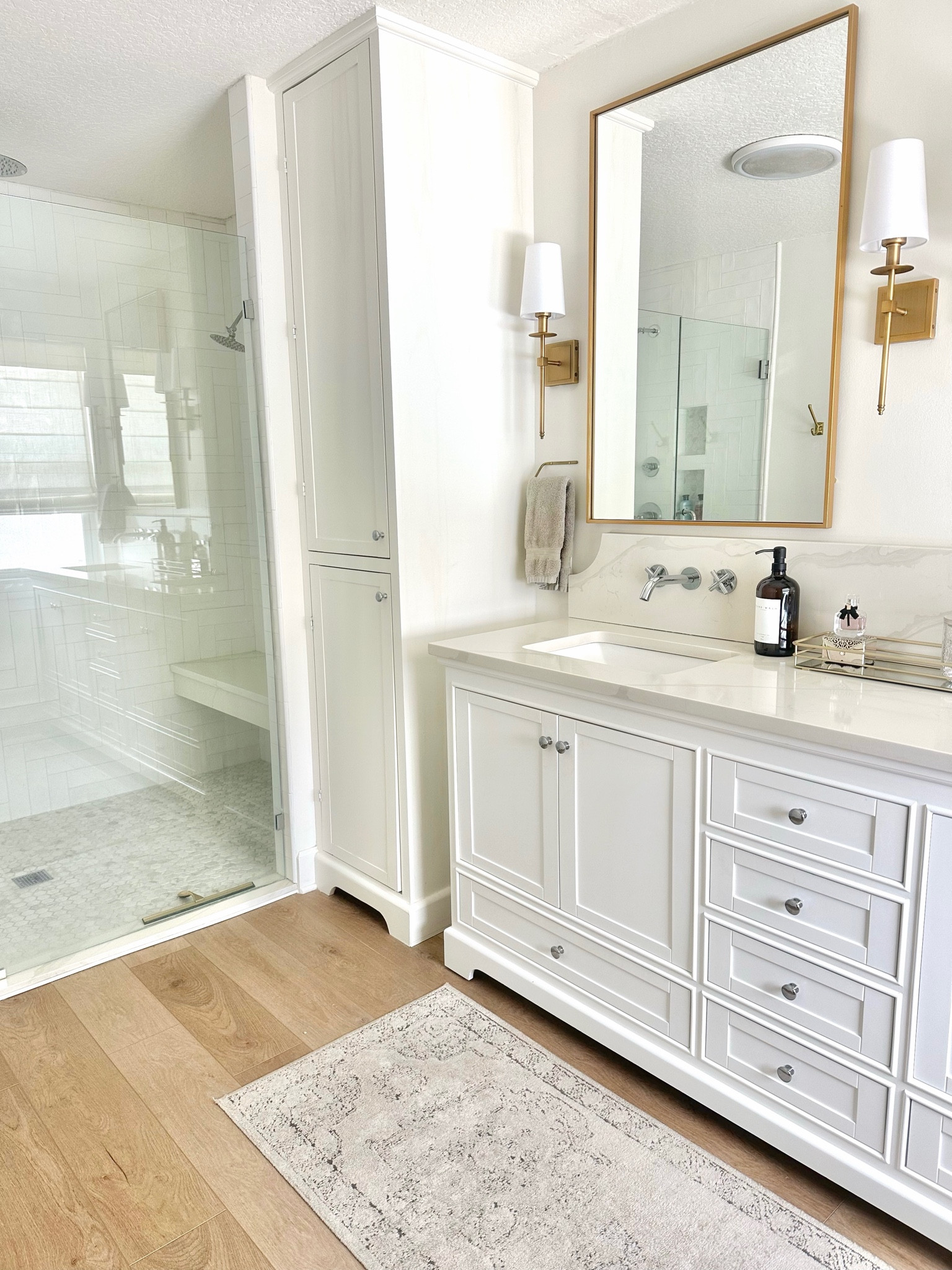 Bathroom fixtures
Master bathroom 
Primary en suite 
Double vanity 
Quartz countertops 
Walk in shower 
Gold mirrors 
Gold sconce lighting 
Wall mounted faucets 

#LTKfindsunder100 #LTKsalealert #LTKhome