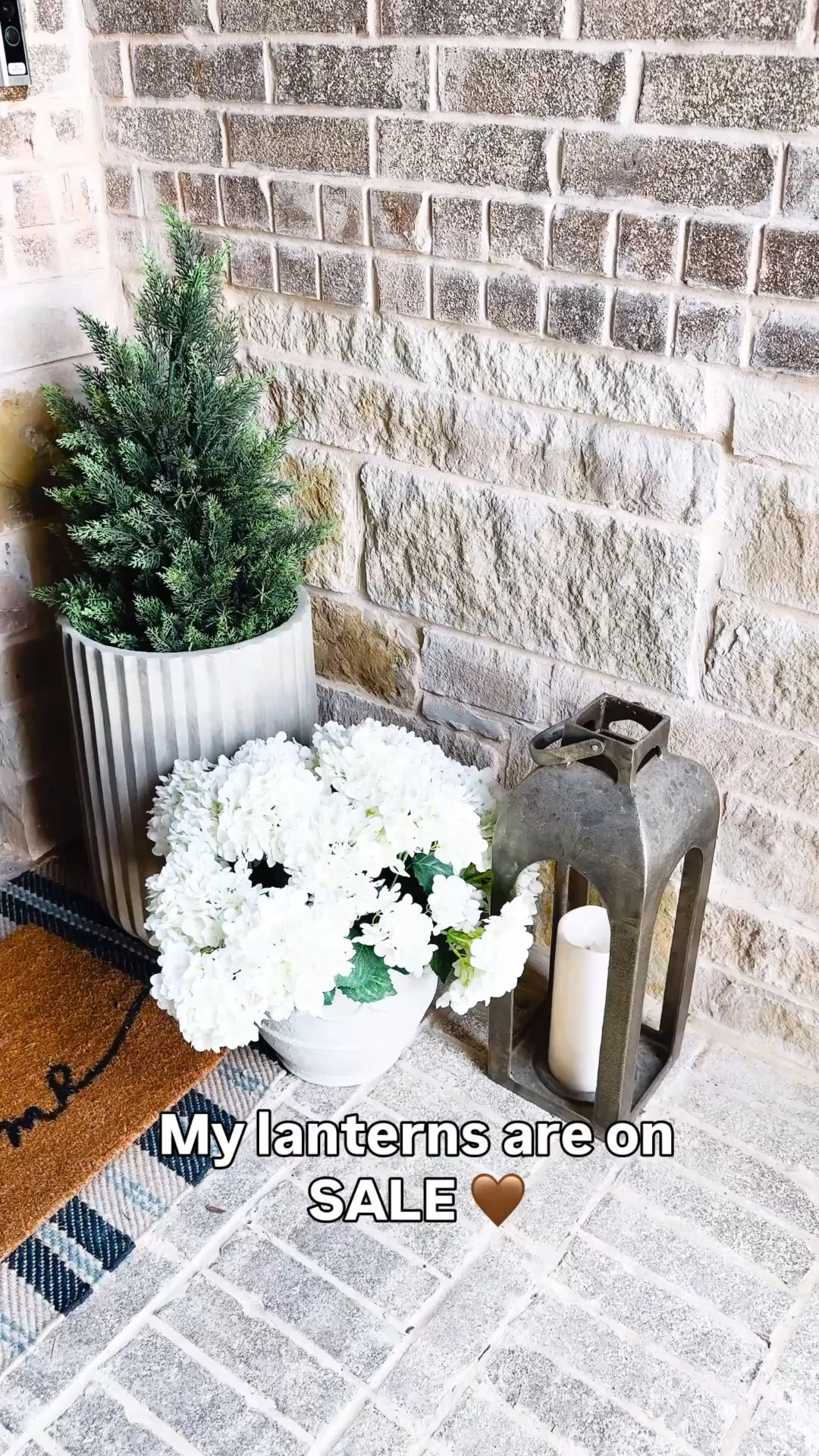 Warm spring porch with a few simple pieces I use every day 🤍 layering textures like faux greenery, outdoor faux florals, and outdoor brass  lantern  makes such a difference out here. Faux hydrangea plant, reeded planter, Potterybarn dupe, front porch decor. I also love layering outdoor mats to add texture  My Target lanterns are currently 30% off and such a good neutral staple for any entryway. Follow me on LTK for daily home, Amazon, and styling finds.

#LTKstorytime #LTKSaleAlert #LTKHome