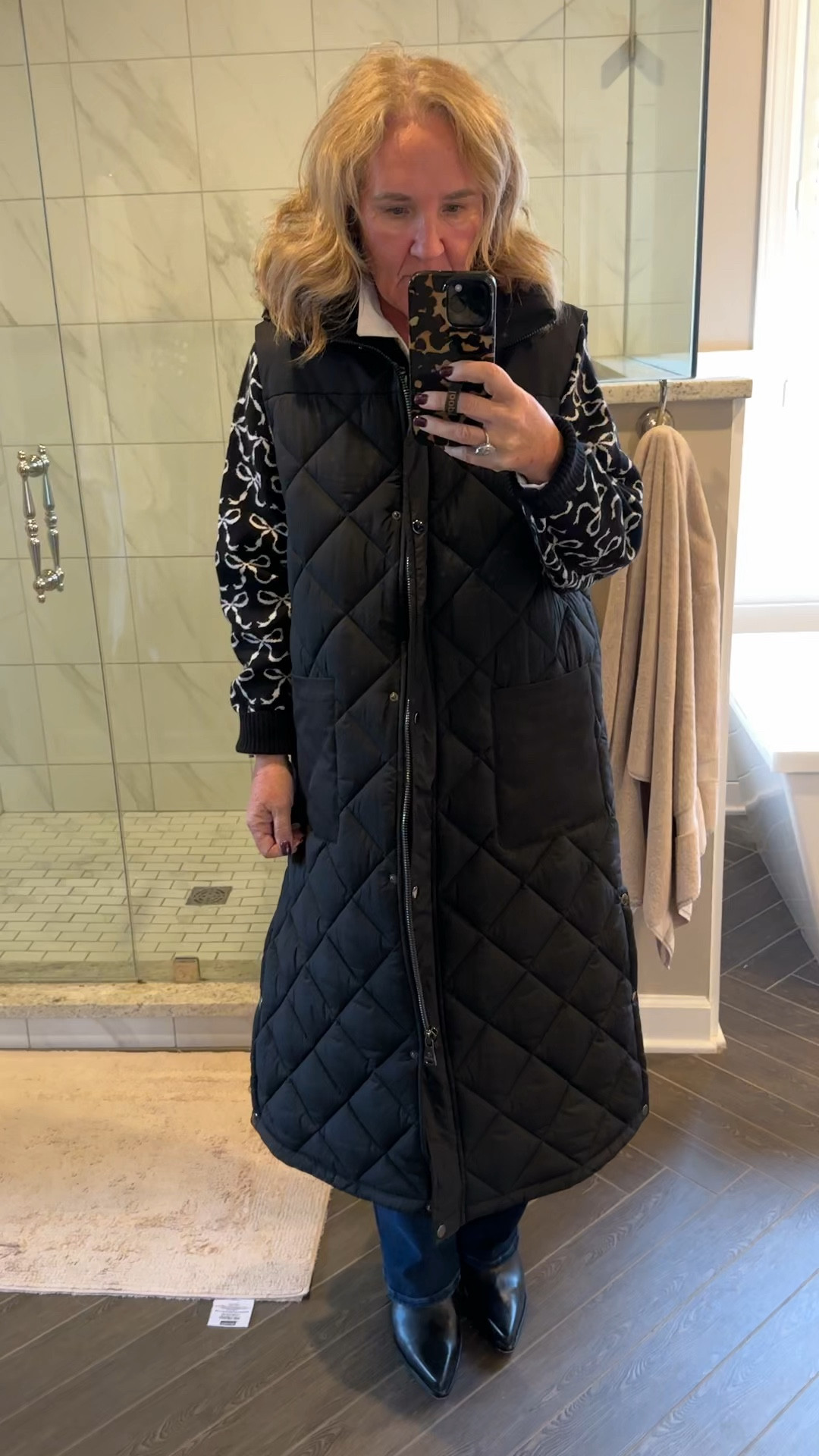 Order your smaller size in this high-quality quilted vest by Bernardo. Tap on the link to go to the site to see the current sale price.
Sweater it’s true to size, but I sized up for an oversized look 
Jeans, true size, I am a 29 petite 
Boots you have to size up a full size. My normal size is a 9.5. These are a 10.5. They are waterproof and leather! 

Cold weather outfit, fall outfit, winter outfit, winter coat, quilted vest, long quilted vest, Anthropologie bow sweater 

#LTKOver40 #LTKHoliday #LTKMidsize