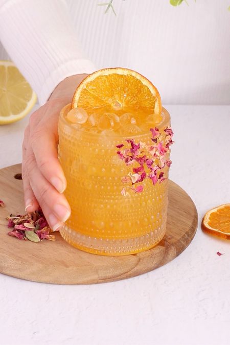 Enjoy this immune boosting mocktail with an orange and rose rim. With health promoting ingredients like turmeric and ginger, this low sugar recipe is the ideal nutritionally beneficial sip. 

#LTKfitness