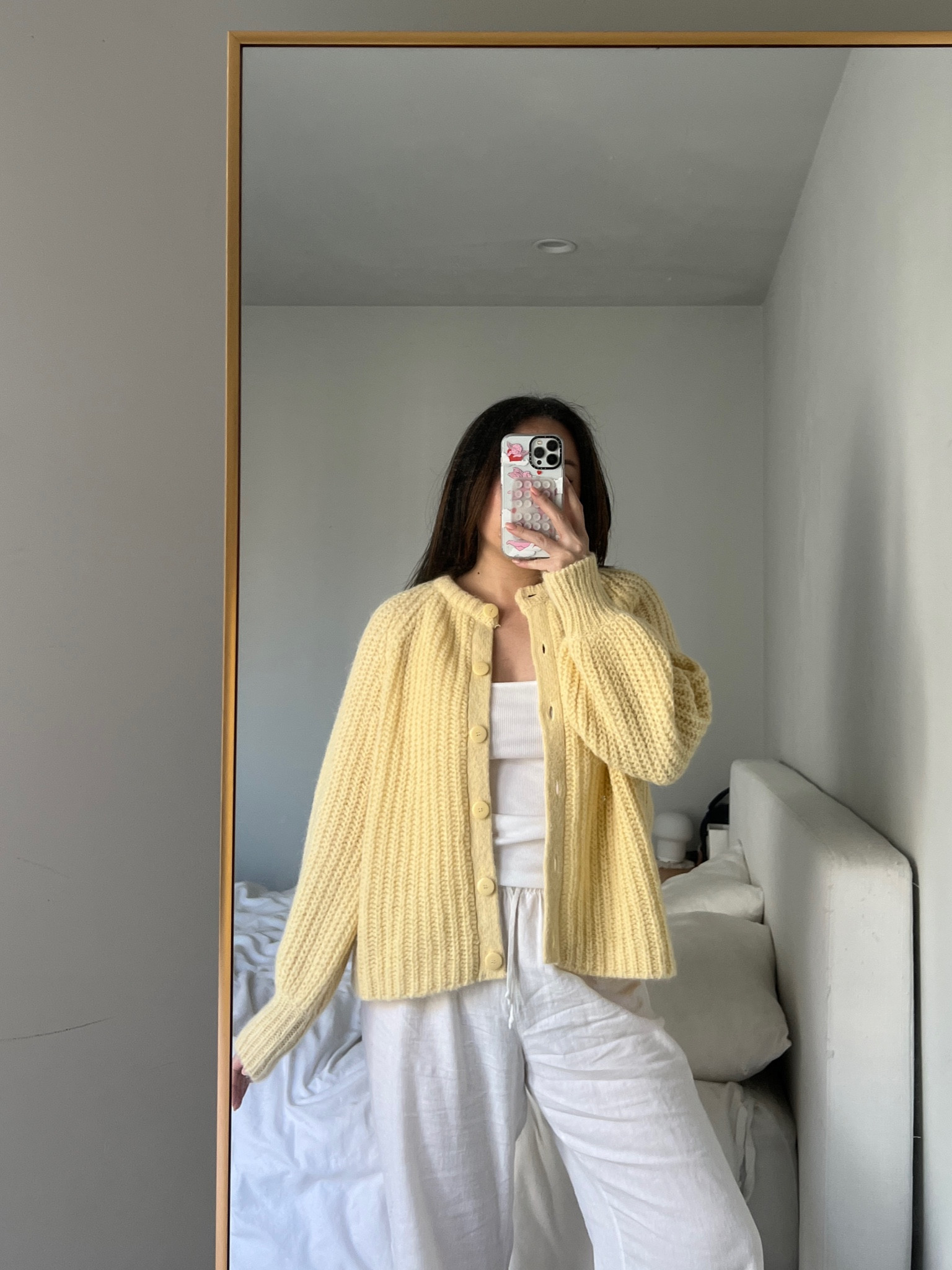 sezane cardigan in butter yellow! Wearing a size Medium. 