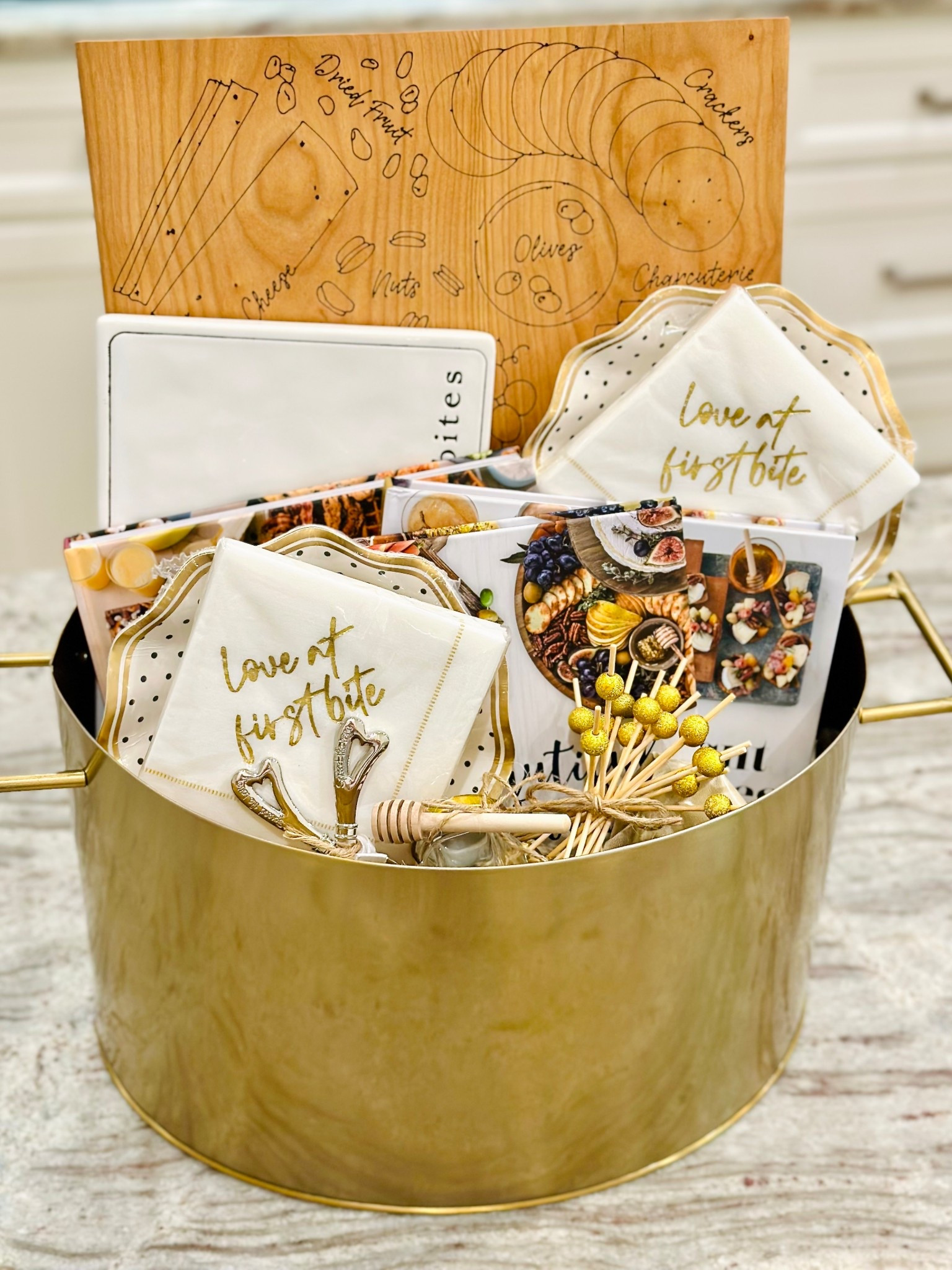Gift a basket of hosting favorites along with Maegan Brown’s, AKA The BakerMama, bestselling boards and cookbooks. It’s sure to bring cheer during the holidays or for any occasion.

#LTKParties #LTKHoliday
