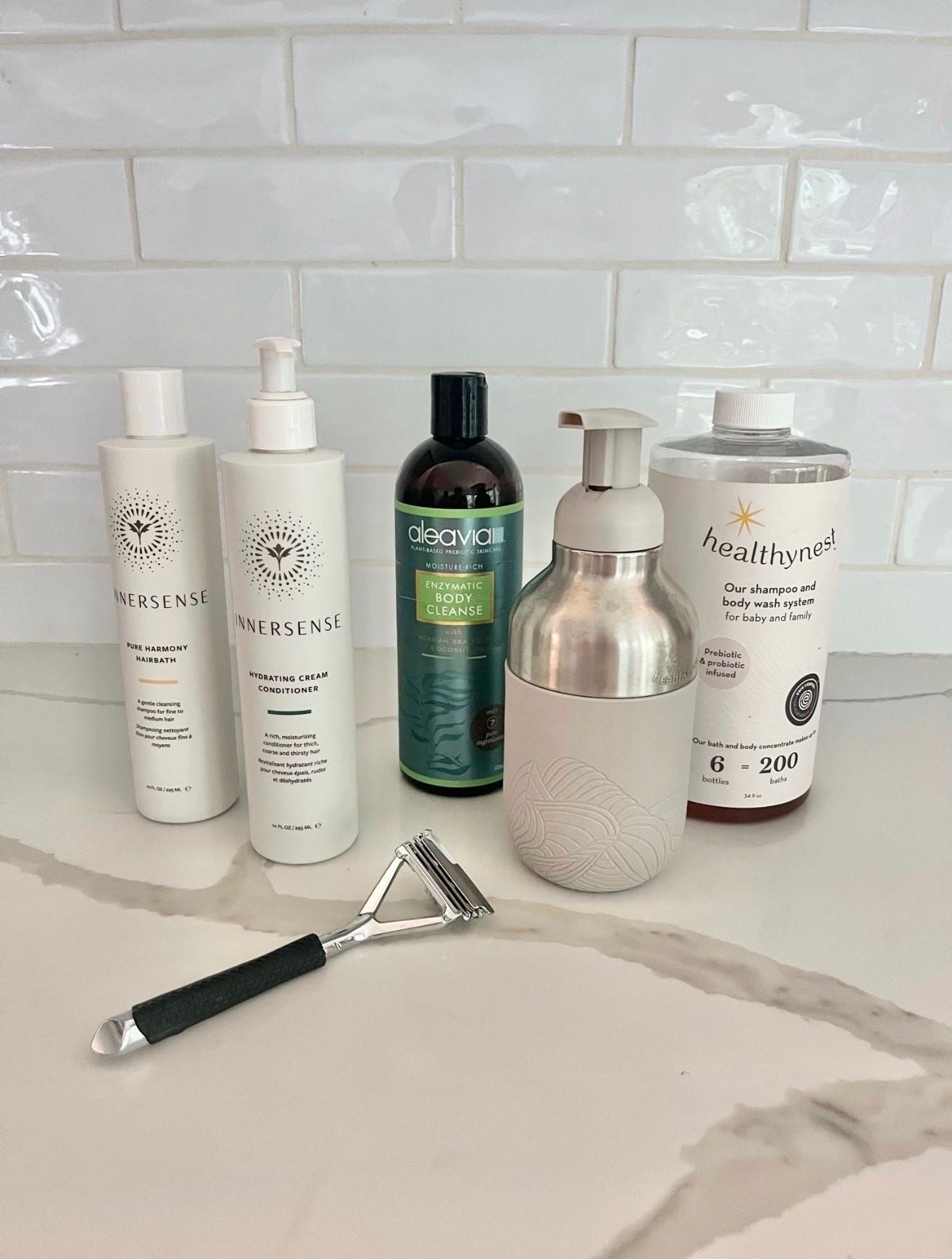 Here’s everything non toxic we use in the shower!  
👉🏼My kids use the Healthy Baby wash, it comes as a concentrate that you dilute with water and use the soap dispenser that it comes with to make a foaming wash.  I love it so much I often use it too. 
👉🏼 aleavia unscented wash is super clean and has less than 10 ingredients. it also comes in a bunch of different fragrances if you prefer. I really like the grapefruit one as well. 
👉🏼 I’ve been using the Innerscense shampoo and conditioner and really like it, they also have a great purple shampoo that’s not pictured here but works awesome. 
👉🏼 this razor is the only one I’ve ever found that doesn’t have a conditioner strip, so it’s completely nontoxic.  Buying the rubber grip is a MUST. trust me it is super slippery in the shower and you will need it. #LTKSummerSales #LTKFamily

#LTKKids #LTKmomlife #LTKselfcare
