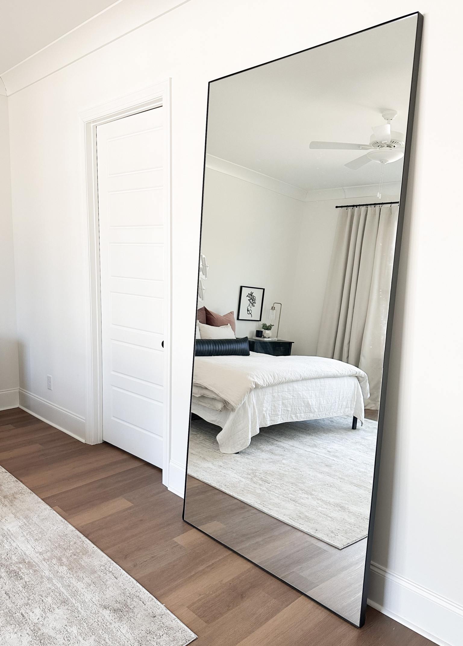 I love how a mirror can brighten a space and make it feel even bigger. This oversized mirror is one of my favorite pieces in my bedroom. It’s pretty big - 8-feet tall and 4-feet wide - but, with 10-foot ceilings the room can definitely handle it. This exact mirror was custom made by Room & Board, but below are similar options to add to your home. #competition #ltkfind

#LTKhome #LTKFind #LTKstyletip