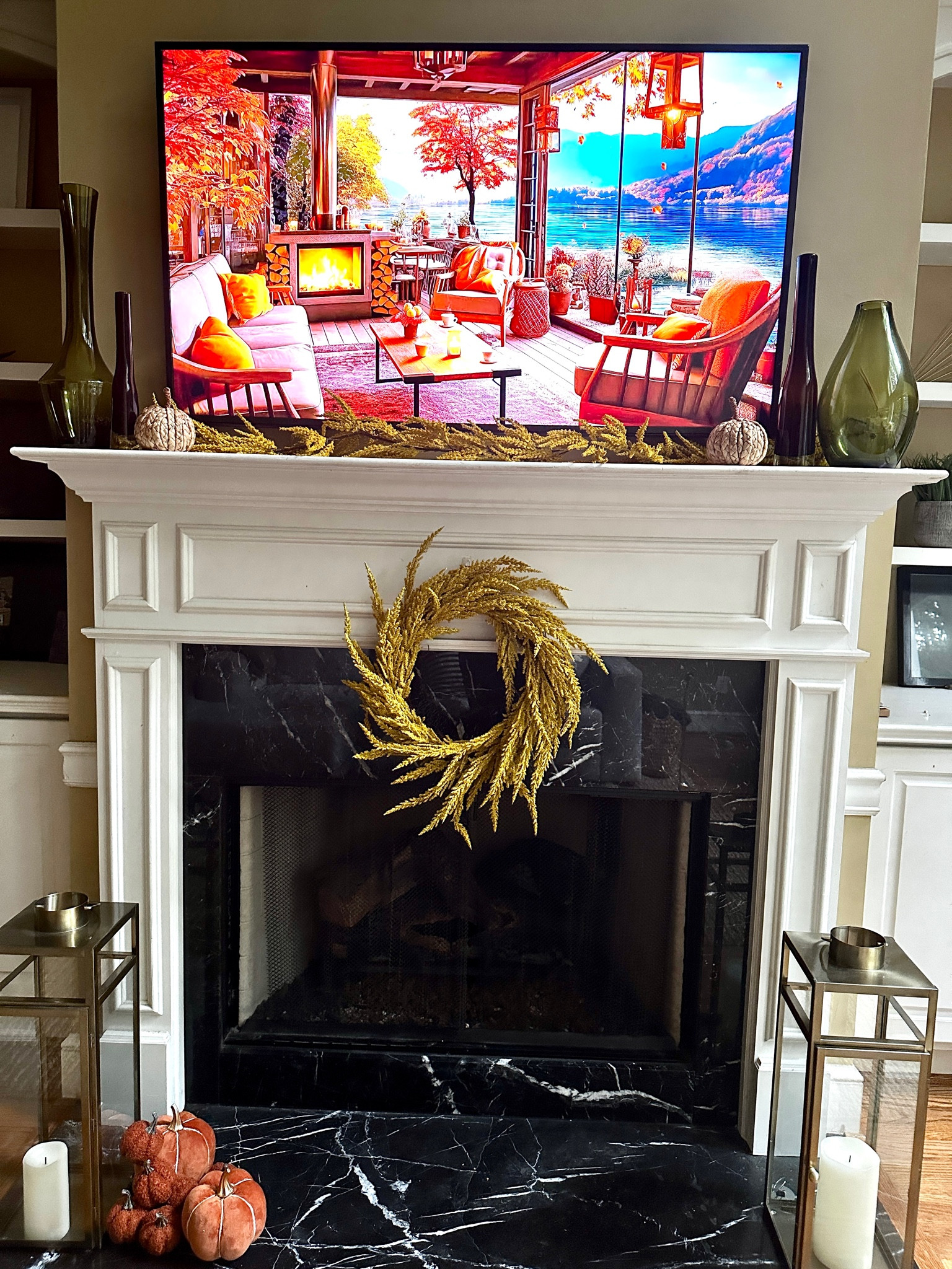 Fall Family Room Mantle 
Fall Garland Fall Wreath Gold Lantern Battery Candles Green Vase Brown Vase 

#LTKhome #LTKstyletip 

#LTKSeasonal