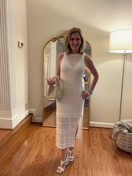 This crochet tank dress is very body skimming throughout. The removable slip has stretched to it, and the dress has a slit at the left hand size extra small.

#LTKStyleTip #LTKOver40 #LTKSeasonal