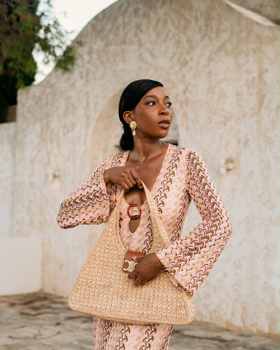 The Raffia Tote 

A softly structured woven tote takes center stage here, adding warmth, texture and an effortless resort feel to the look. Its oversized silhouette feels both practical and elevated, while the natural raffia-style finish pairs beautifully with the blush-toned dress for a relaxed yet polished statement. Perfect for carrying your essentials, it brings an easy summer-luxury mood to the entire outfit.

#LTKsummer #LTKbag #LTKstyletip