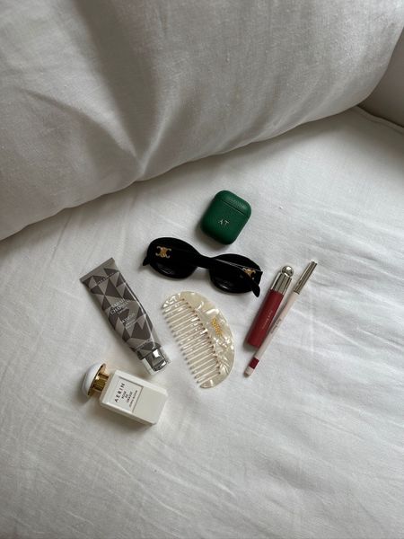 What's in my bag, rare beauty lip, not another bill airport case, sarah champman hand cream, silkie hair comb, sunglasses, aerin perfume

#LTKbeauty #LTKitbag #LTKSeasonal