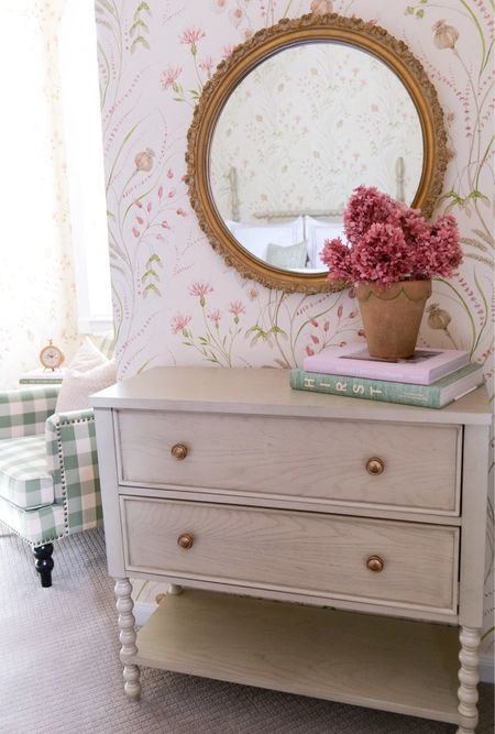 To complete the look, we accessorized the room with small pieces like the custom wallpaper art I created to add character and art. You can see more on how I did this on my Instagram highlight labeled pink & green room.  We also added a few pieces of furniture to create a functional reading space for our guests. The green gingham armchair provides a cozy spot for reading and sipping coffee or just relaxing and looking out the window, all while giving a nice contrasting touch of patterns. We also added a matching dresser to the bed with a mirror over its top with a great find from Round Top, Texas, and this adds a spot for guests to have a mirror as well as store their clothing. Extra blankets were added in this dresser in case the guests get cool at night or while sitting in the armchair. Together, these elements create a warm and inviting space that any guest will find fantastic!

#LTKhome #LTKunder100