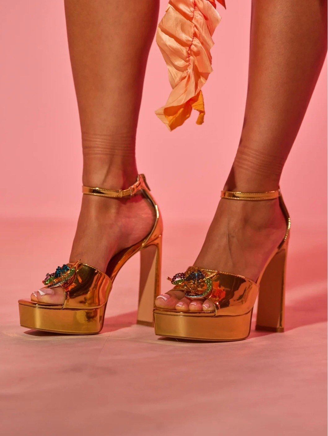 Gold platform heels with jewels detailing and a bold block heel. High shine, glamourous, and made to stand out. 

#LTKootd