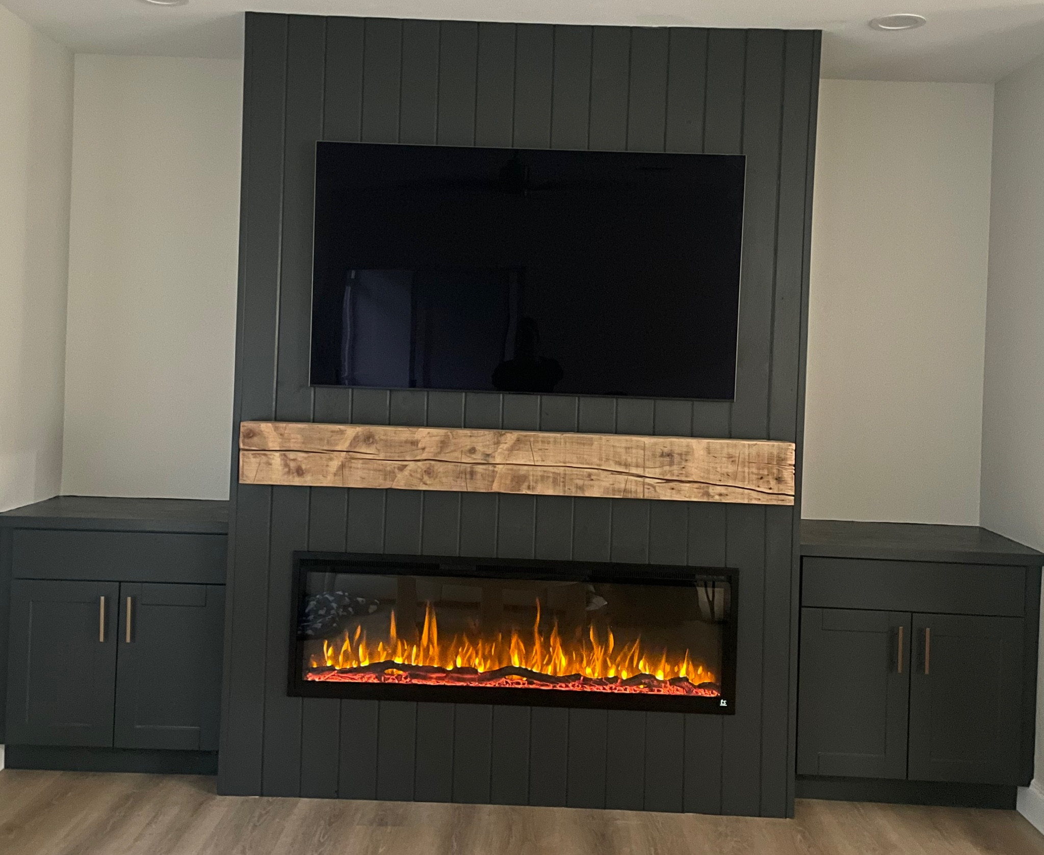 Built-in at the house is almost complete - pending floating shelves!

Fireplace, tv, hardware, countertops, & cabinets linked below. Mantel was created custom at a local sawmill - cedar wood, 72 inch, hand hewn/distressed look. 

#fireplacemantel #builtin #electricfireplace

#LTKFamily #LTKHome #LTKStyleTip