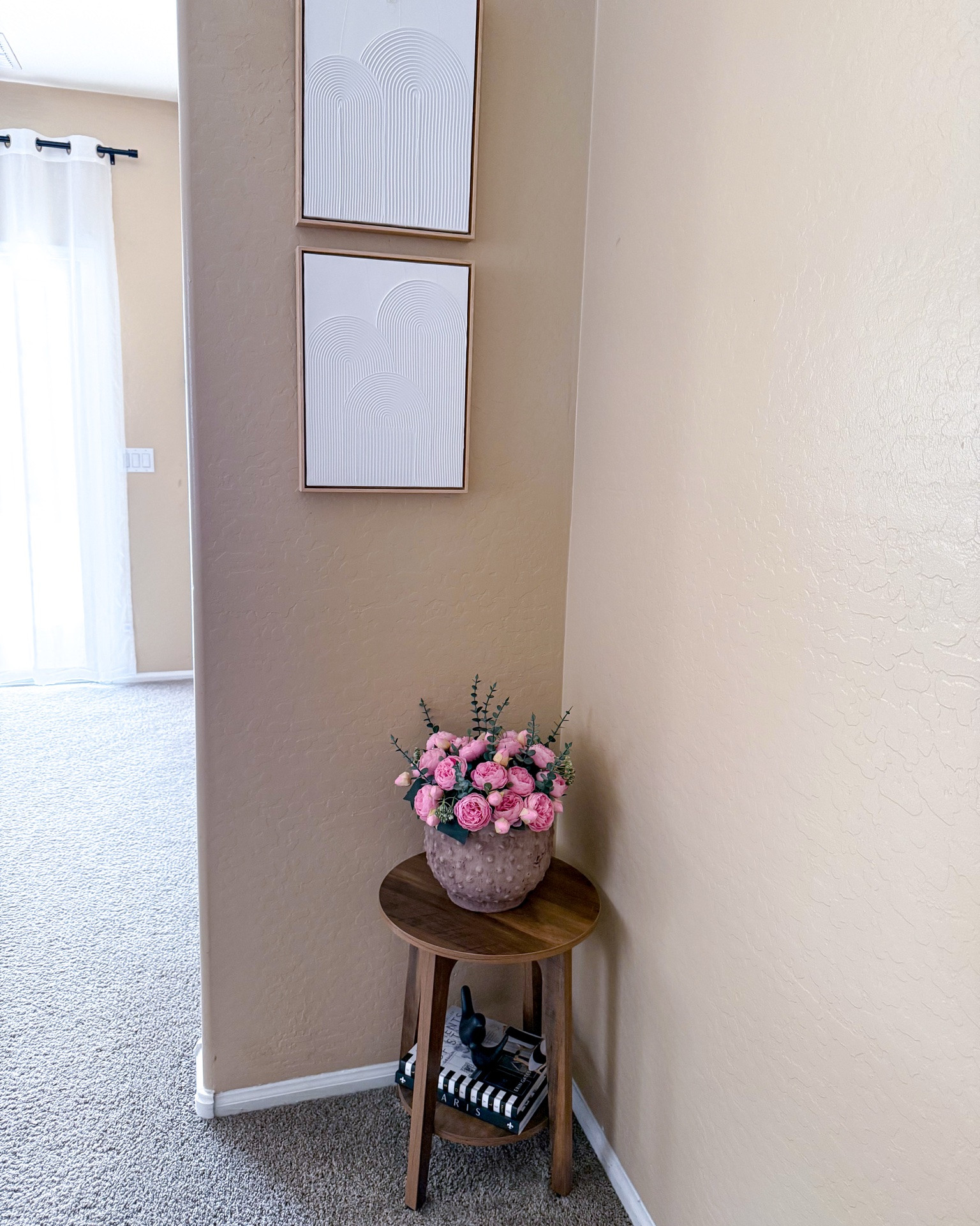 This cute two-tier side table from Amazon and wall art from Target create a charming corner styling in a small space. The table is sturdy enough to hold several books or decorative items.

#LTKSeasonal #LTKActive #LTKSaleAlert