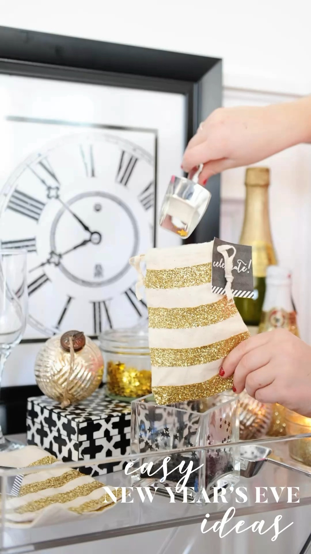 Lots of quick and easy DIY New Year’s Eve Party ideas and recipes. 
- Pop clink Fizz party for the whole family. Grocery store bakery cake with popcorn edges added and fun sodas.
-DIY confetti bar to make your own mix to toss at midnight.
-Brunch party to celebrate with the littles at noon.
-DIY Anthropologie inspired cheers glasses
- DIY party favor bags
-Easy balloon decor
-Free Printables and midnight kisses
Happy New Year!!🎉⏰🩷

-