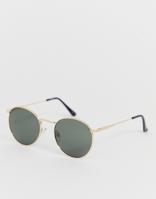 ASOS DESIGN round sunglasses in gold with nose bridge detail | ASOS UK