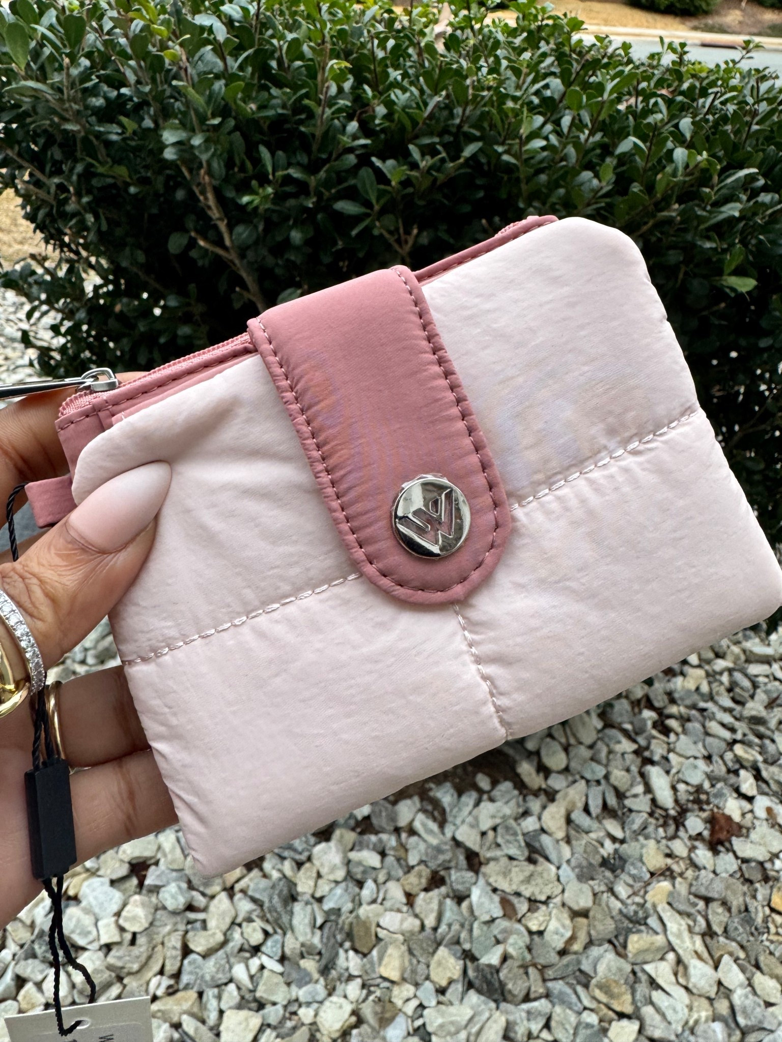 Cute puffer wallet with enough room for my needs! Comes in so many colors mine is pink! 