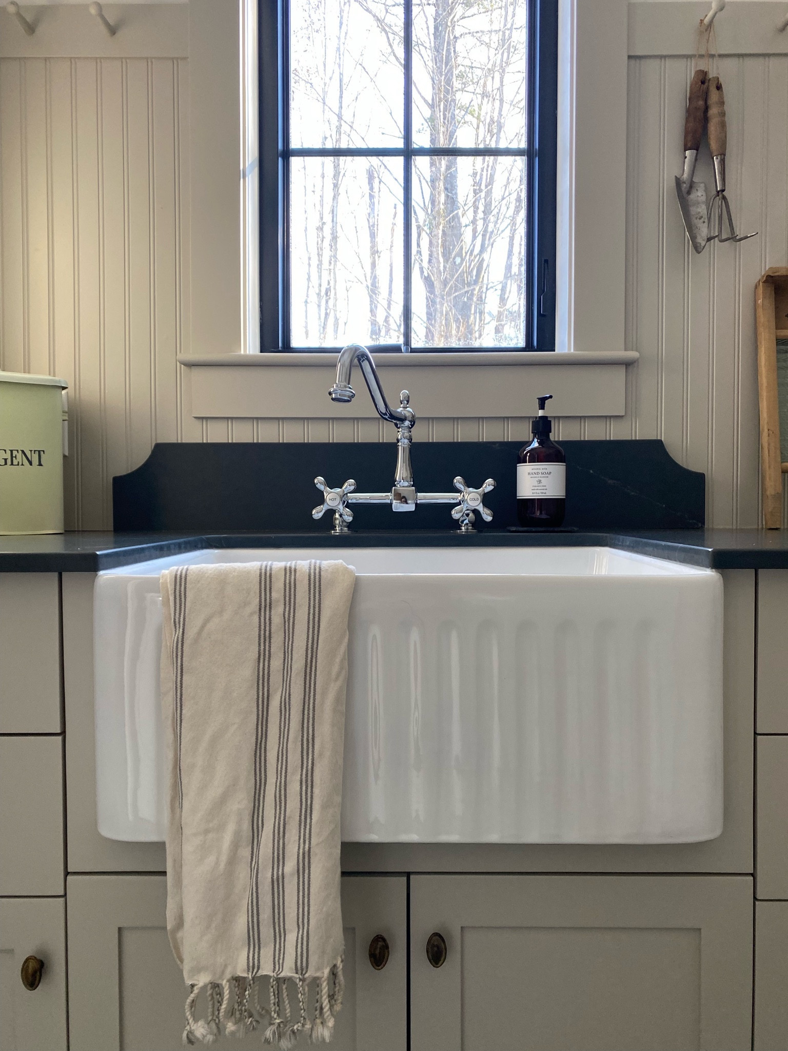 Our laundry room! 🤍 (faucet is same brand but the wall mount option is currently the only available option online - ours is a deck mount in polished chrome)