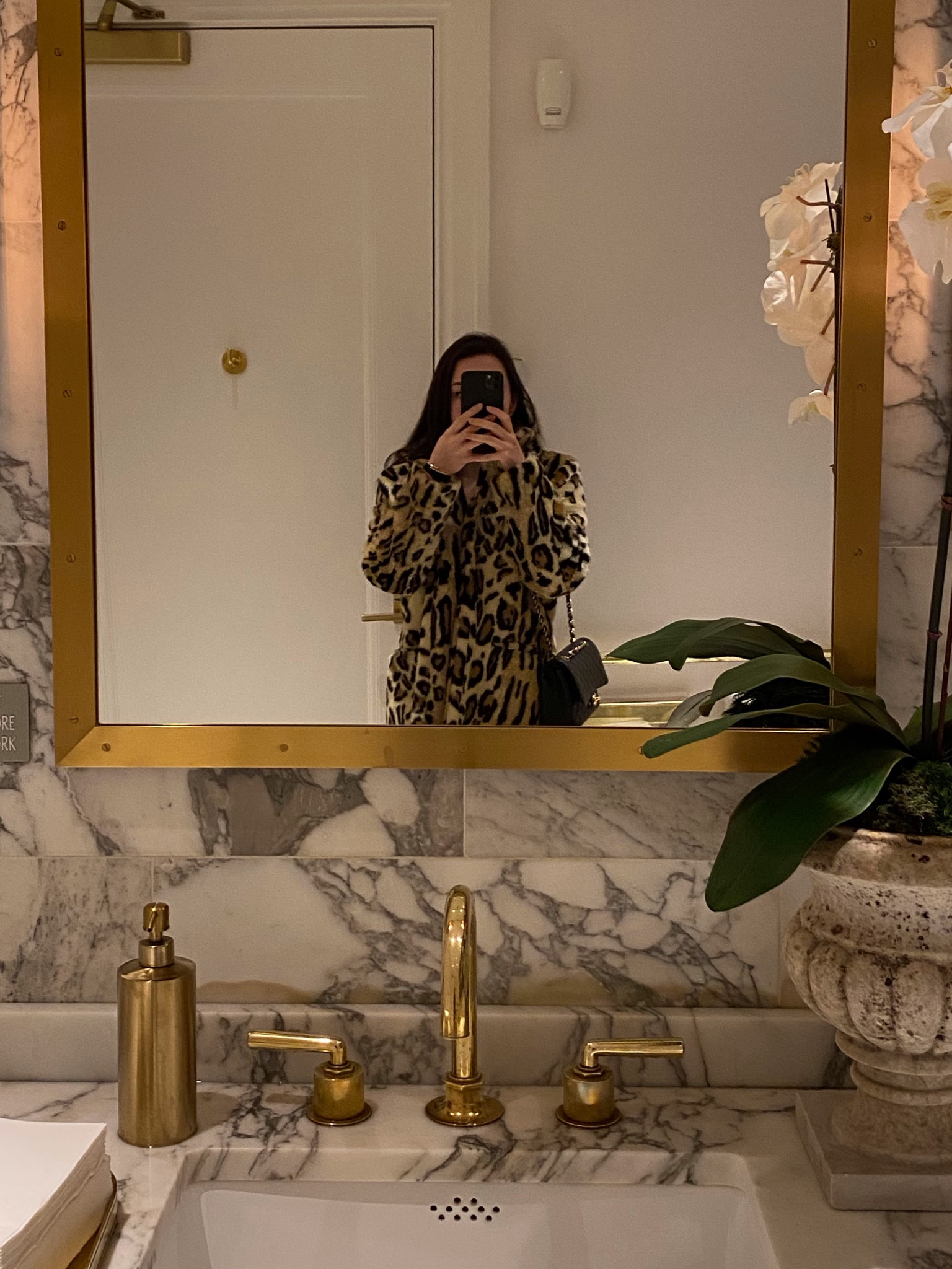 Apparis leopard faux fur coat, Chanel medium classic flap in black caviar leather, Aritzia black sculpt knit long sleeve polo, Kelly belt in etoupe, black Rag and Bone jeans