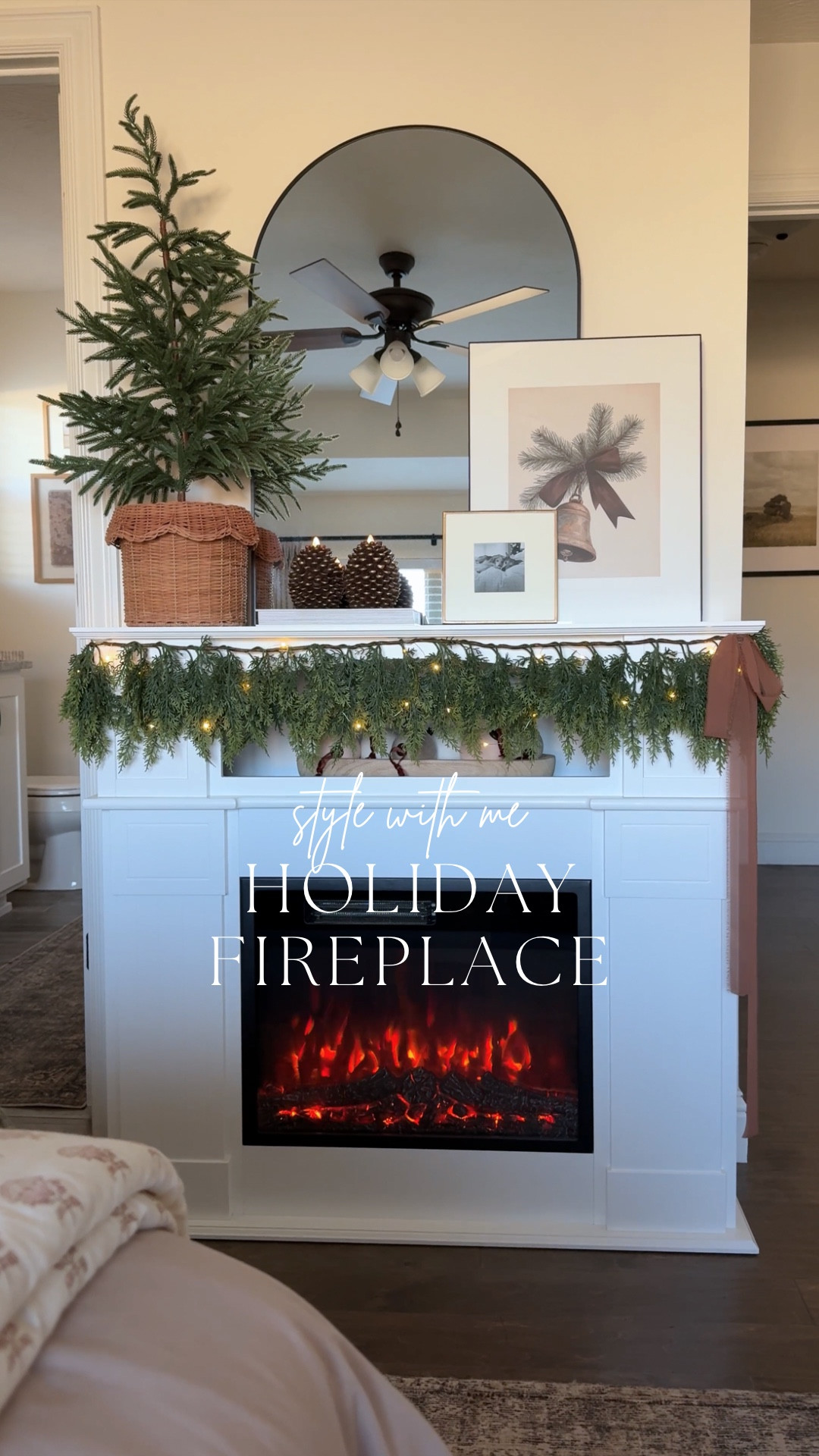Holiday fireplace refresh 🔥🎄 Real‑touch garland, flameless pinecone candles, layered art, and a pretty ribbon finish—kept simple, cozy, and full of holiday warmth. And this potted pine tree moment? Obsessed. Proof that it really is the little details that create the magic ✨

#LTKHoliday #LTKHome