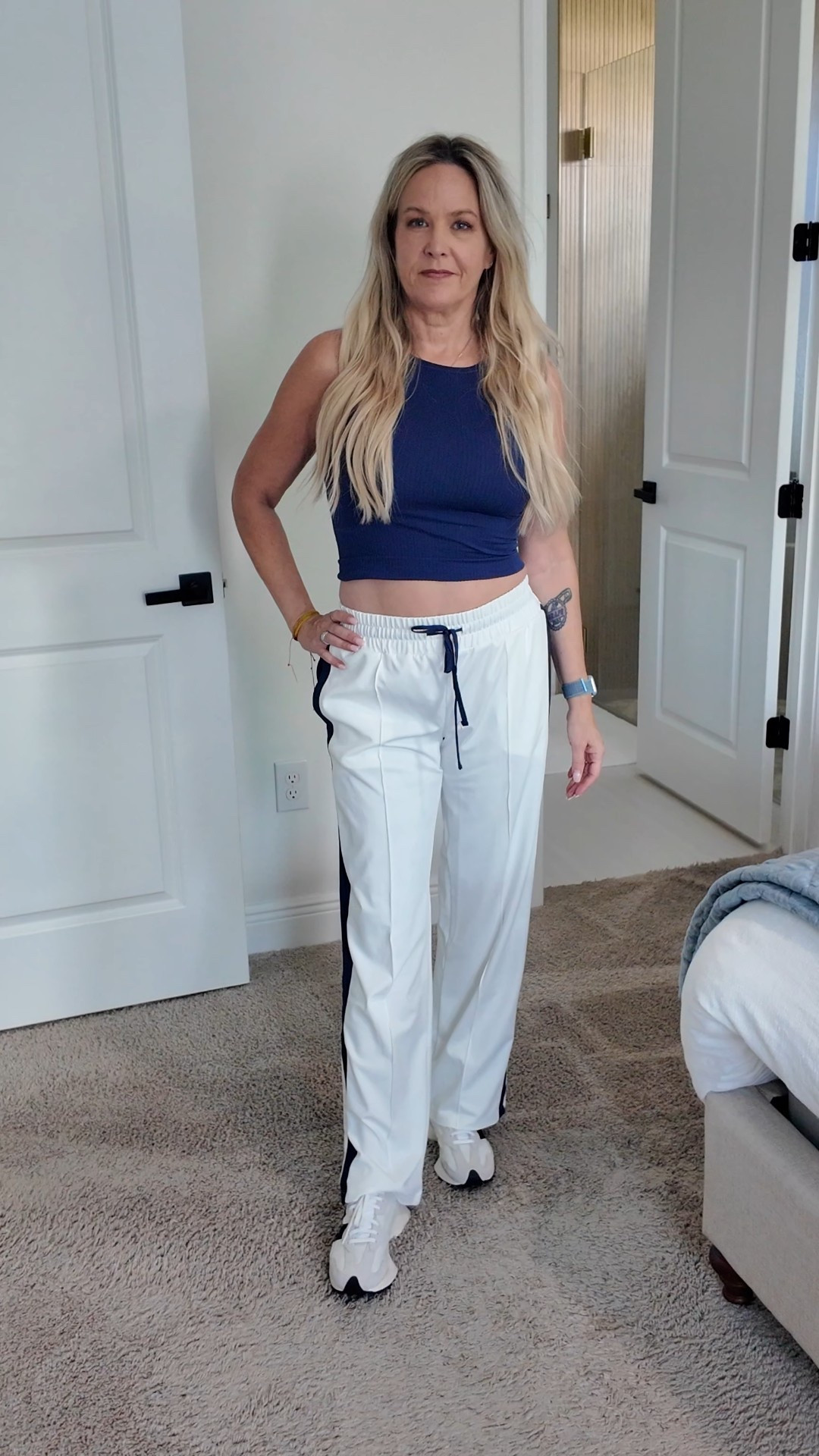 Fun casual sporty fall Anthropologie outfit! Reegan tank in ink color size XS/snl and daily practice track pants in a XS paired with new balance 327 in a size 7.5.

#LTKFindsUnder100 #LTKOver40 #LTKShoeCrush