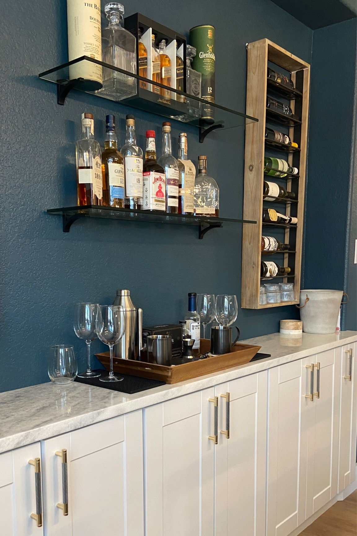 We built our own bar using wall cabinets from Home Depot #bar #winebar #winerack 

#LTKhome #LTKmens #LTKunder100