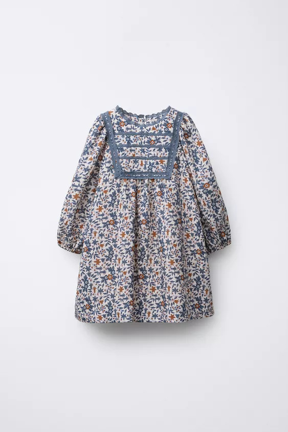 Dress with a round neck and long sleeves with elastic cuffs. Teardrop button closure at the back.... | Zara US