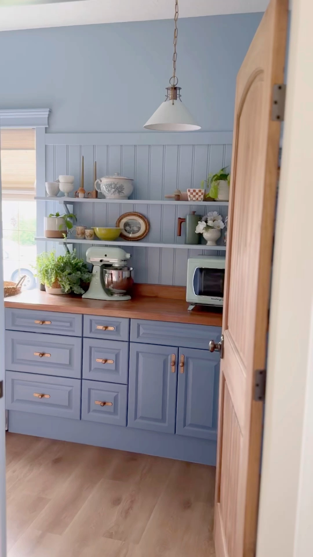 Modern English country cottage pantry, wall panelling, beadboard, butcher block countertop, studio McGee lookalike pendants, white mini fridge, budget custom bamboo shades 


#LTKHome