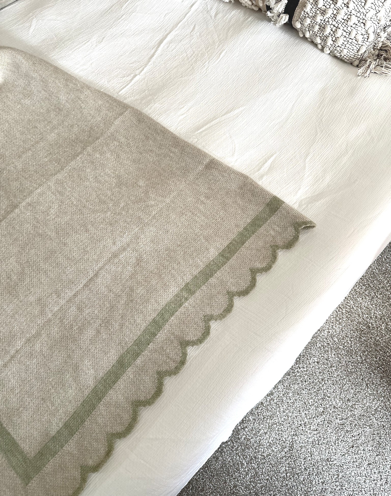 Super soft, springy, scalloped edge throw blanket for my guest bedroom. Comes in green shown and blue! $35 

#LTKHome #LTKFindsUnder50 #LTKSeasonal