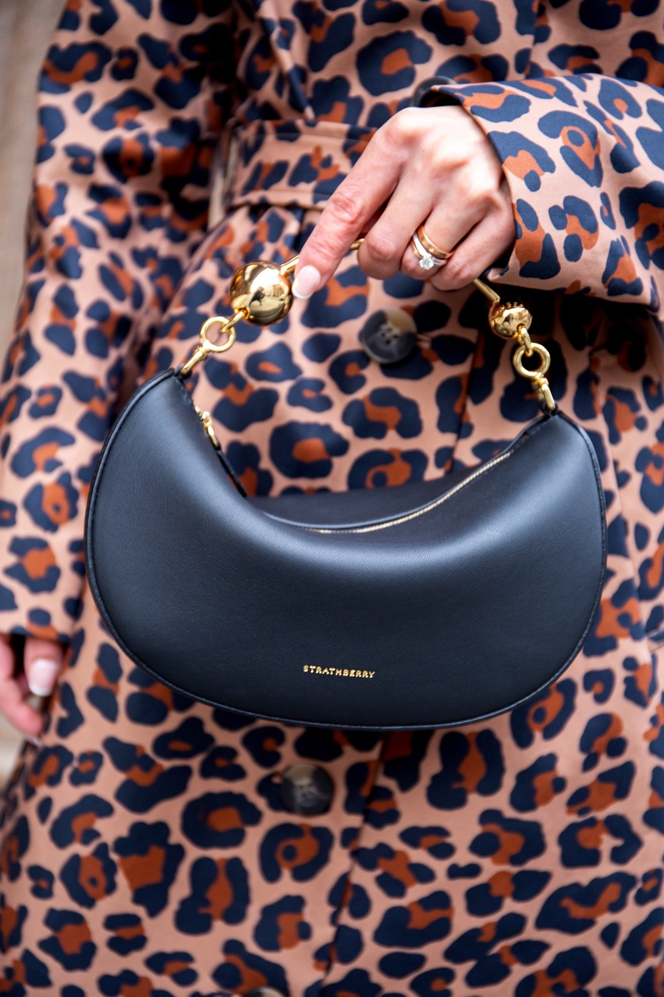 The new season introduces the Crescent Moon Mini, a smaller size of our Crescent Moon silhouette. Celebrating Strathberry’s dedication to craftsmanship with its sculpted silhouette and iconic Crescent Music Bar handle, it merges contemporary design with timeless quality. This meticulously crafted piece is a bold expression of Strathberry’s artistry, making it a must-have for the new season and beyond. Comes in black, white or red. #blackbag #minibag #chicbag #strathberry



#LTKootd #LTKSeasonal