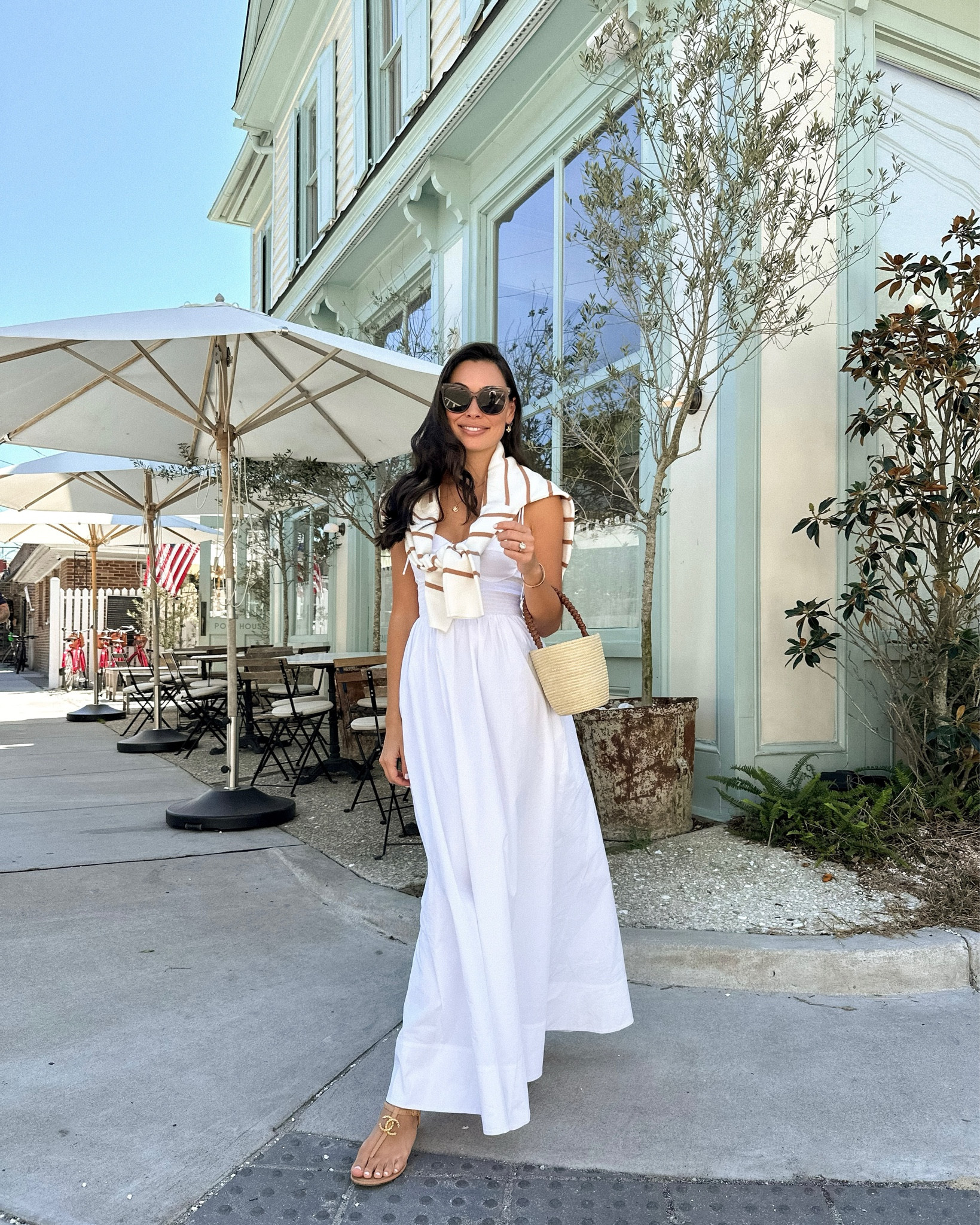 Kat Jamieson wears a white dress and stripe sweater with a mini bag in Charleston. 

#LTKitbag #LTKtravel #LTKstyletip