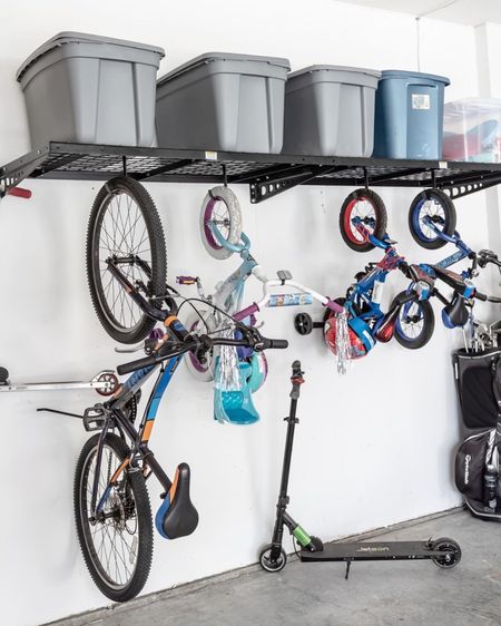 Heavy duty garage organization hard at work! These wall mounted shelves double up got vertical bike storage too! 

#LTKfindsunder100 #LTKfamily #LTKhome