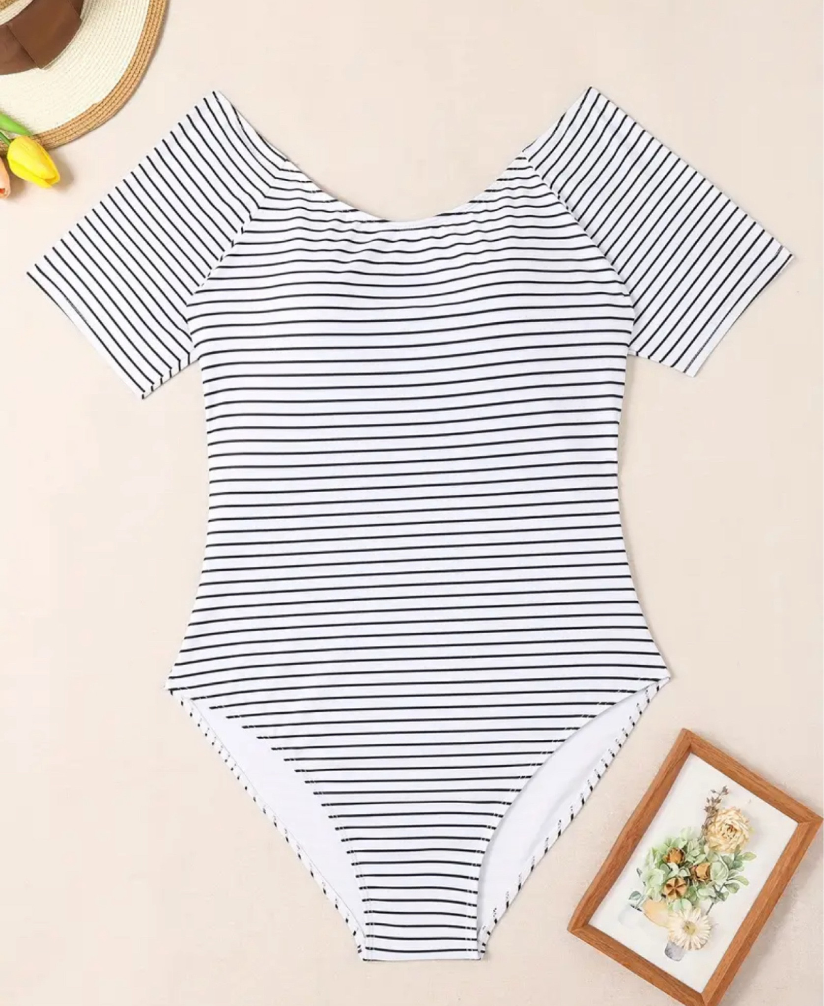Black + white striped modest swimsuit 

#LTKmidsize #LTKswim #LTKplussize