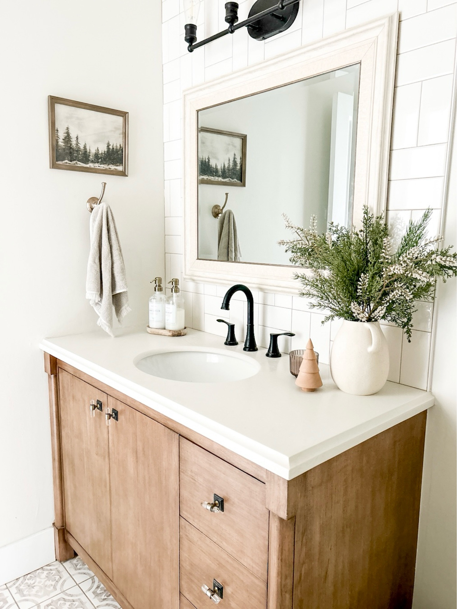 Our vanity here is discontinued but I found one and the same color that is similar! 

Tile is from floor and decor it is called woodfield lane matte porcelain tile and we love it! 

Bathroom, Christmas bathroom, Christmas decor, Christmas art, bathroom decor, bathroom towels, bathroom faucet , soap dispenser, bathroom vanity, bathroom cabinet, target, Amazon 

#LTKHoliday #LTKhome