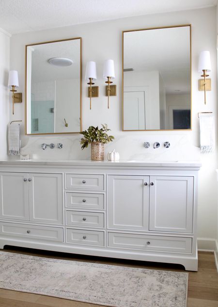 Bathroom Vanity styling
Fall bathroom decor
Mixed metals 
Coastal bathroom design 
White vanity 
Brass lighting 
Large mirrors #LTKSale

#LTKhome #LTKunder100
