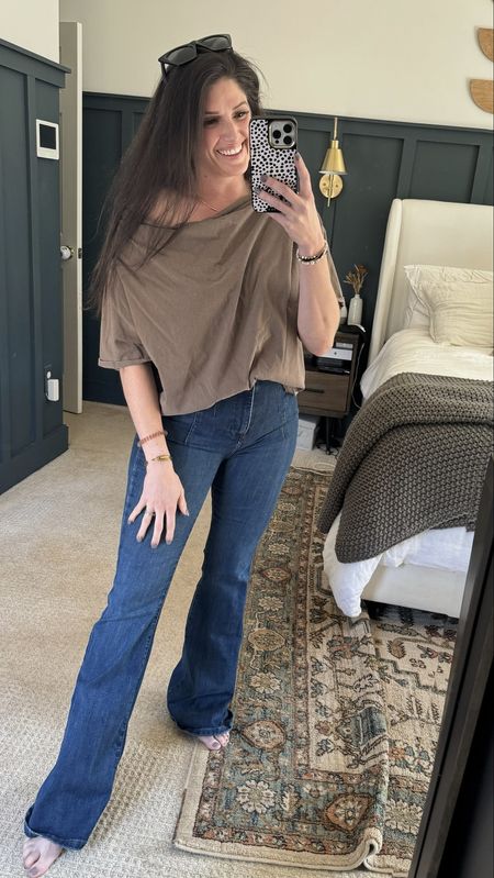 My absolutely favorite pair of jeans styled 3 ways! These viral Free People flare jeans from We The Free come in tons of washes and sizes. SUPER flattering (found them for a lower price too!). Slouchy Nuuds top, orange sweater tucked in the front. Mom outfit, winter outfit, spring outfit, jeans outfit

#LTKSeasonal #LTKfindsunder100 #LTKmidsize