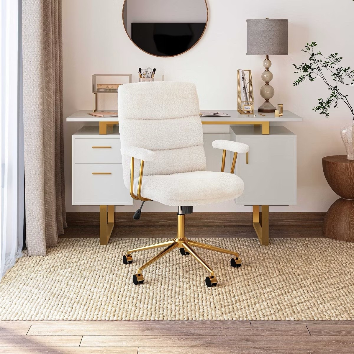 Work-from-home goals! This chic boucle desk chair with gold accents is the upgrade your office space needs. It’s not only super comfortable but also adds a luxe touch to your workspace. The soft sherpa-like texture makes it cozy, while the modern gold base keeps it stylish and elegant.

I’ve linked this exact chair plus a roundup of similar boucle desk chairs and chic office seating options. Perfect if you’re creating a Pinterest-worthy home office setup.

Shop this boucle desk chair and my top picks for stylish alternatives to elevate your office space—plus every detail from this chic setup so you can recreate the full look at home.
