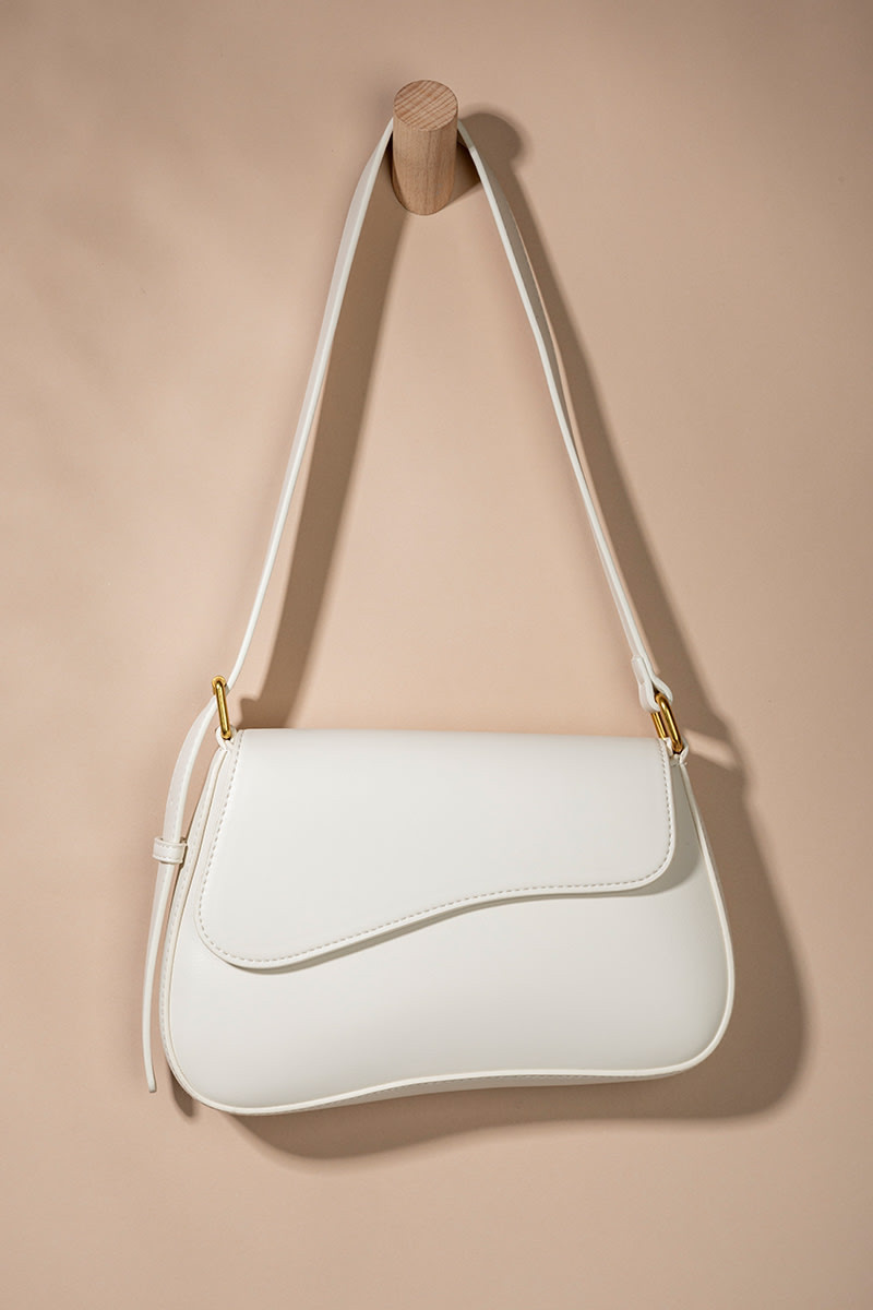 Maricela Curved Saddle Handbag | Francesca's