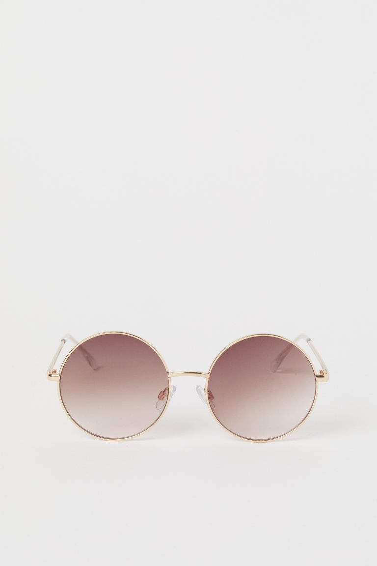 Round sunglasses with metal frames and tinted, UV-protective lenses. | H&M (US + CA)