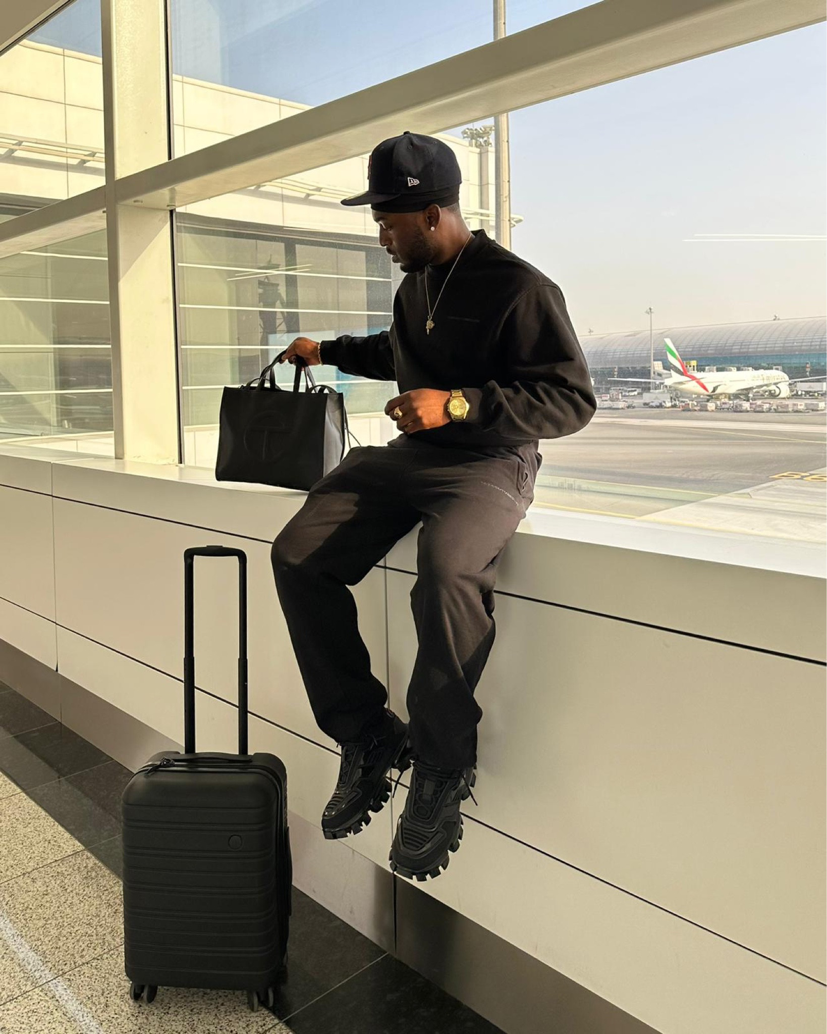 Airport outfit, black suitcase, black new era cap, men’s prada trainer, new balance, black tracksuit, joggers, crew neck sweater, prada, weekday 

#LTKstyletip #LTKmens #LTKSeasonal