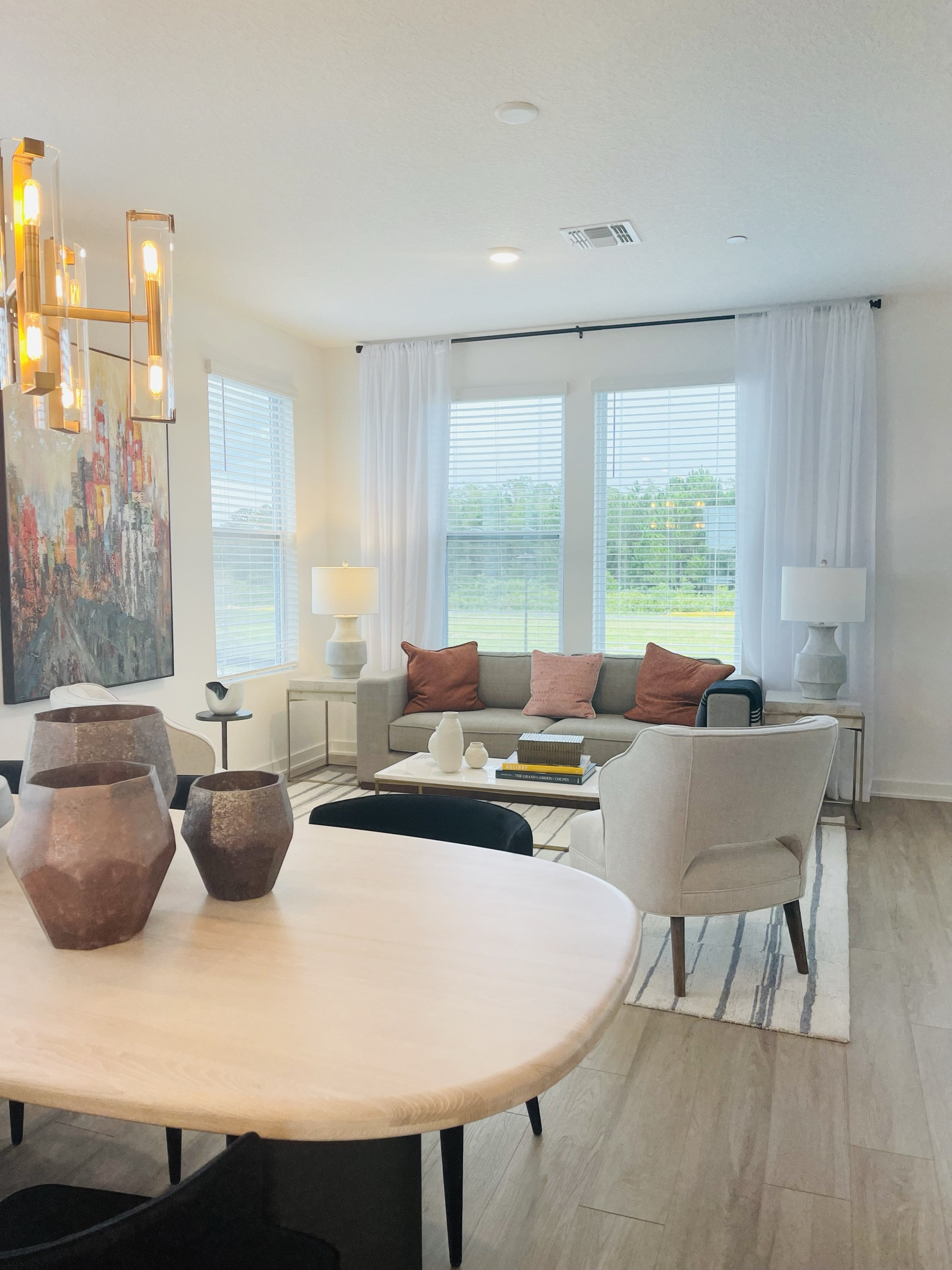 Small Living Room Design with Neutral Color Palette, muted pops of color and large wall art brings the space together 

#LTKhome #LTKstyletip