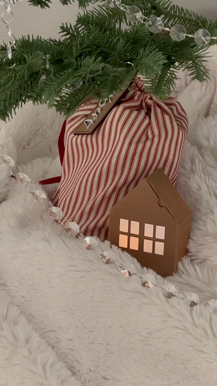 I’m obsessed!!

This is the cutest way to wrap gift cards while also creating ambiance under the tree at night!

These remote controlled flickering tea light candles have a timer + these house gift boxes support a small business.

For more creative Christmas wrapping ideas— follow @ivoryandwesthome 

#christmaswrappingideas #minimalistchristmas 

#LTKCyberWeek #LTKHome #LTKGiftGuide