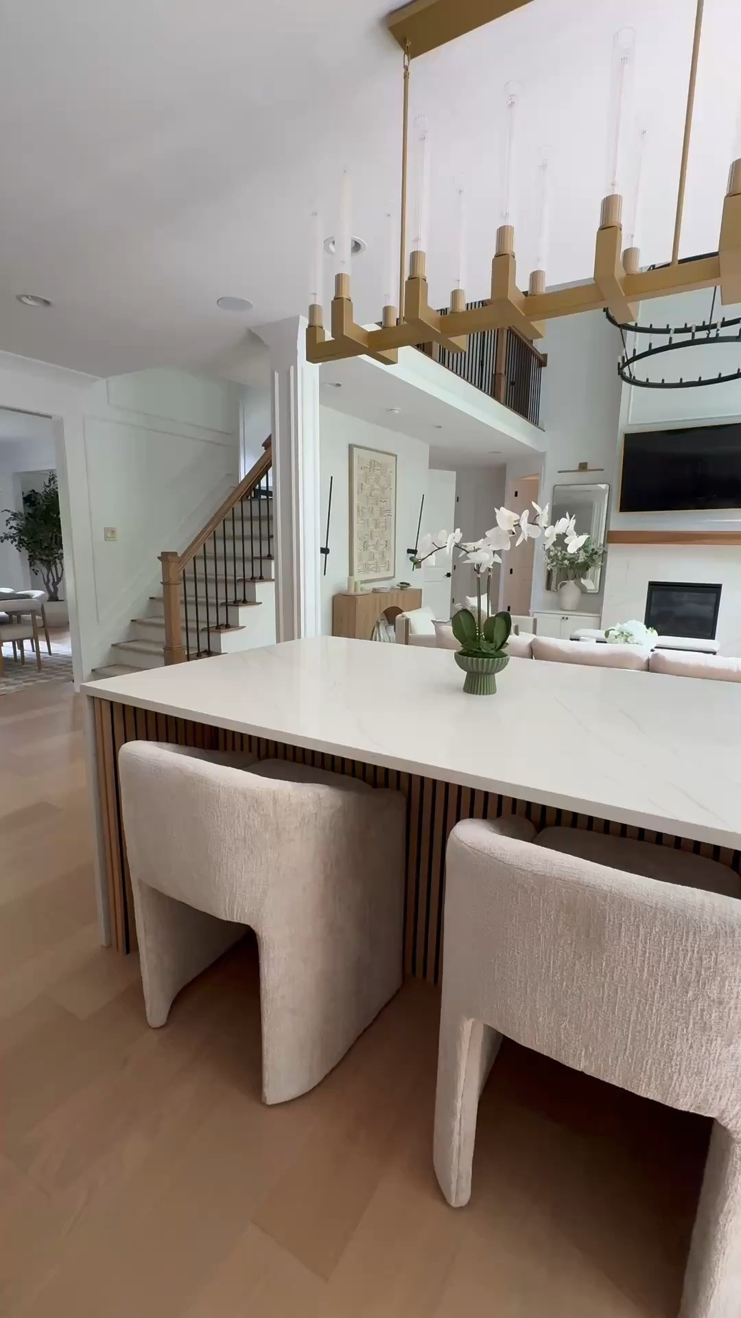 Modern kitchen island light, modern counter stools , wood paneling , gold chandelier

#LTKSaleAlert #LTKHome