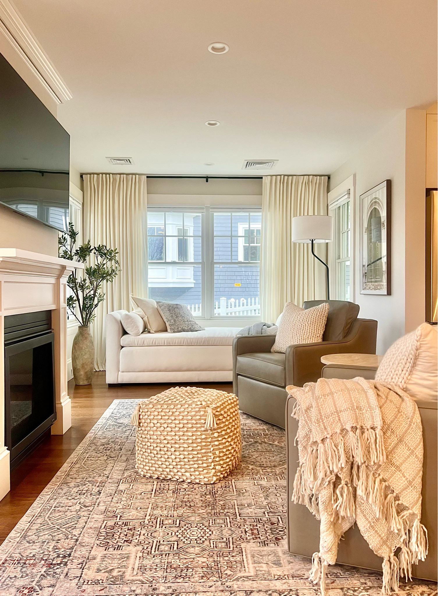 Living/family room decor!
Daybed sleeper, throw blanket, curtain panel, oriental rug, curtain end caps, floor lamp, pillow covers, faux branch, vases, pouf.

#LTKFind #LTKhome #LTKstyletip