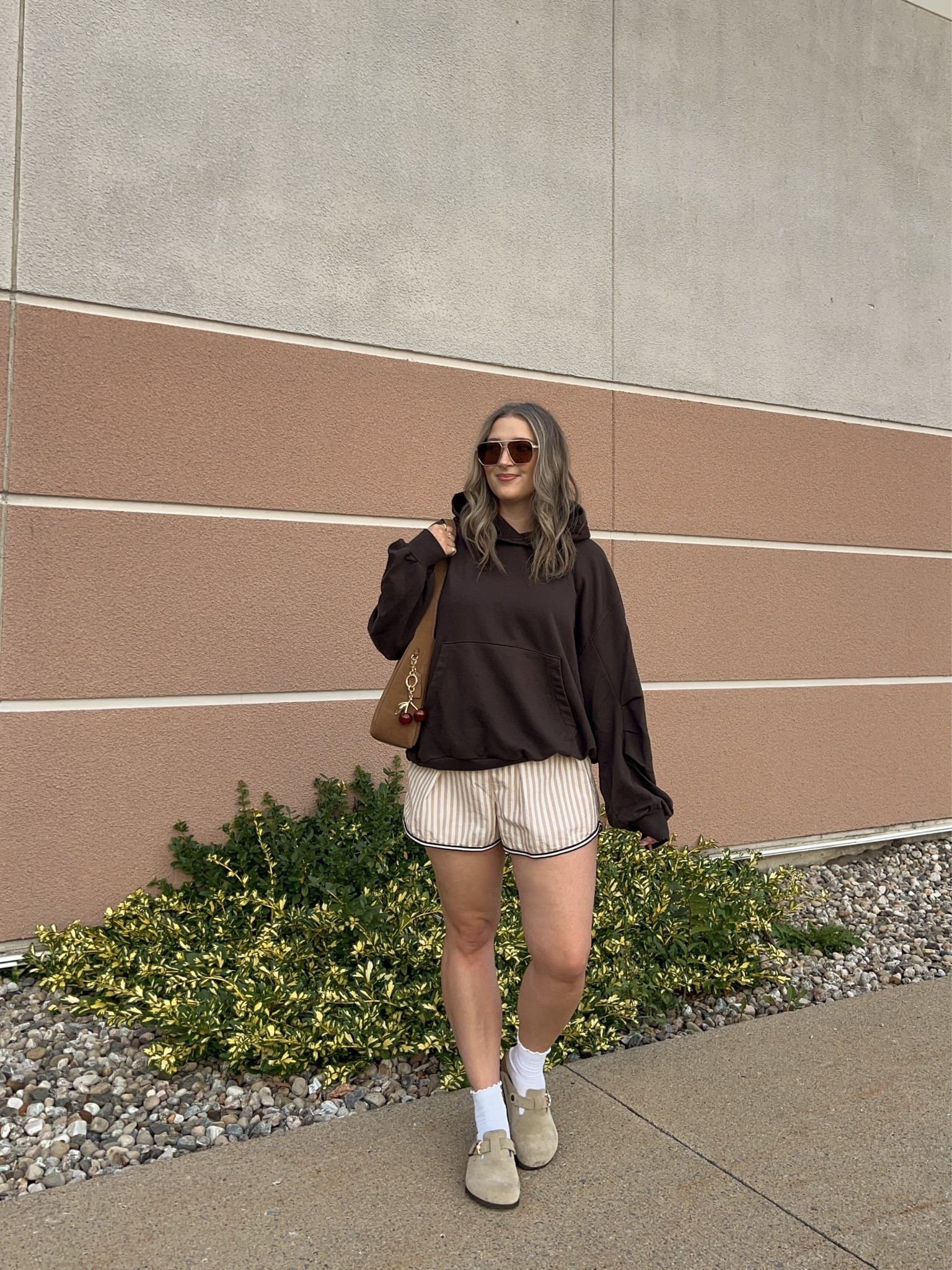 Comfy early fall outfit! Wearing M in the chocolate brown hoodie. Wearing L in the striped boxer shorts but should have done M (exact Canadian shorts link under “similar products”). I’m a 9.5-10 shoe and wear a 40 in the Birkenstock clogs

#LTKfall #LTKmidsize #LTKsale