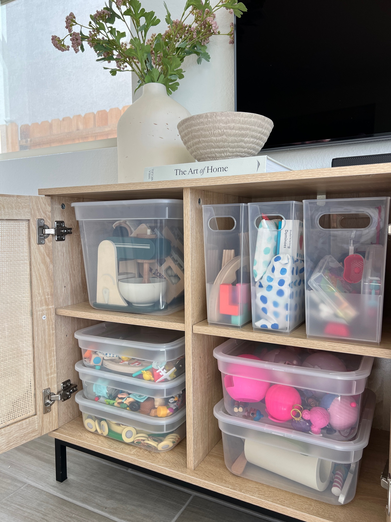Toy storage organization in our living room. I love these Brightroom bins from
Target. Not only are they reasonably priced but they’re stackable and come in a variety of sizes to create configurations needed for whatever sized toys you want to organize and store.