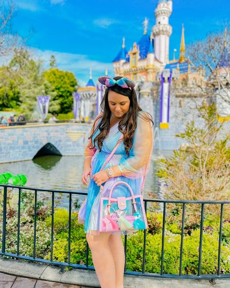 Loved this rainbow tulle dress, available in plus sizes for Disneyland! The tulle is rainbow ombré, the dress is lined and not see through, with an elastic waistband! Also sharing this Sleeping Beauty crossbody bag & a few similar pairs of ears for outfit inspo! 

#LTKtravel #LTKFestival #LTKcurves