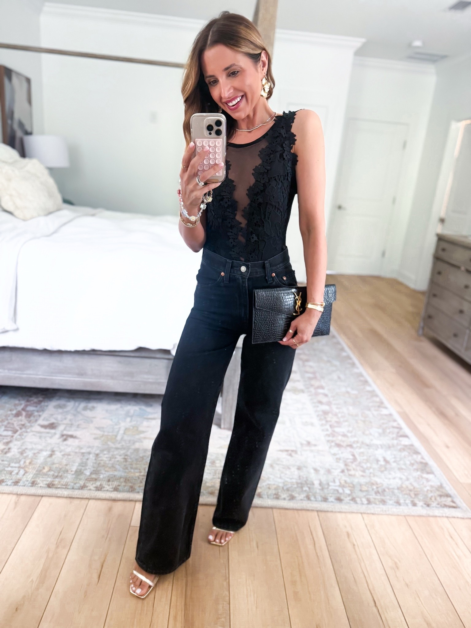 Amazon date night outfit. Amazon lace bodysuit in XS. Levi ribcage wide leg jeans in size 24, color is ‘Rosie Posie’. Gold heels are TTS. YSL clutch. Concert outfit. Girls night out. Dinner date. Vegas outfit. Party outfit.

#LTKTravel #LTKootd #LTKgrwm