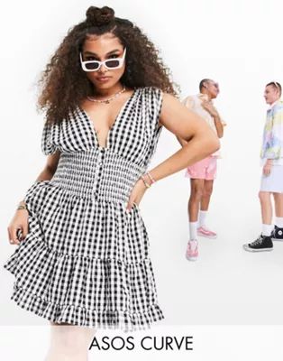 ASOS DESIGN Curve shirred waist button front tiered mini sundress in crinkle in gingham | ASOS (Global)